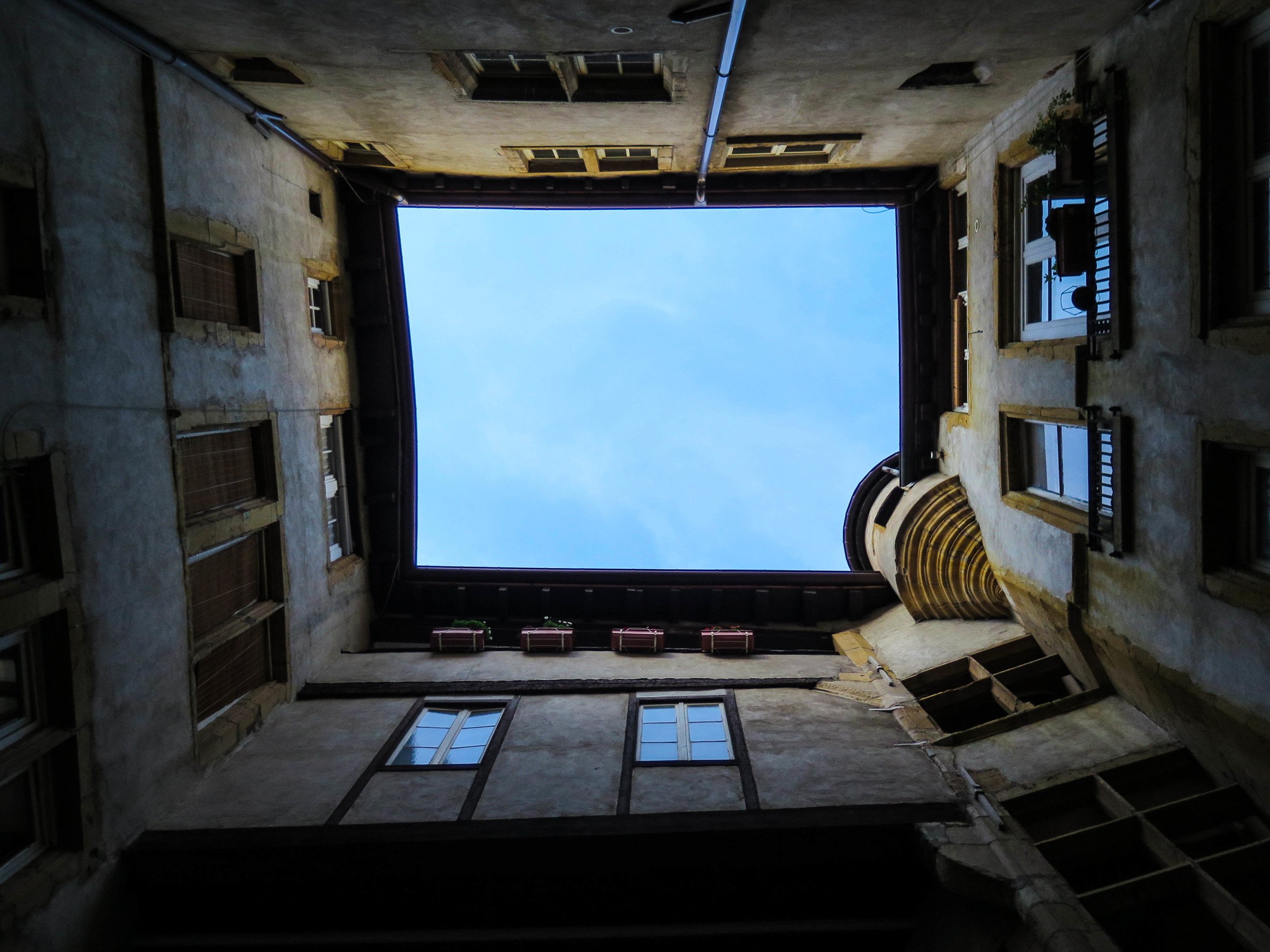 Looking up from our courtyard outside of our apartment.