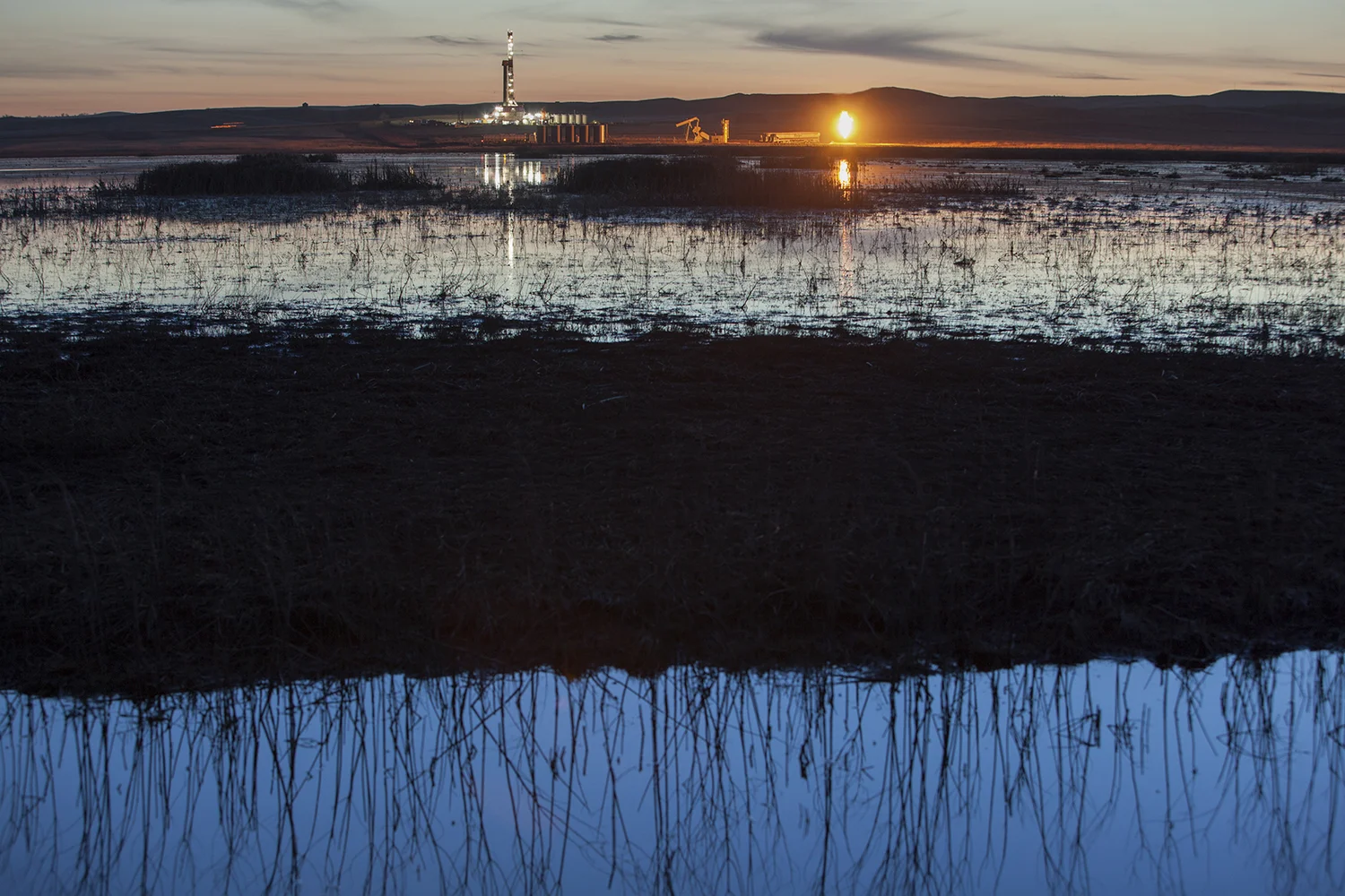 An oil rig and gas flare North of Watford City, ND. 2012
