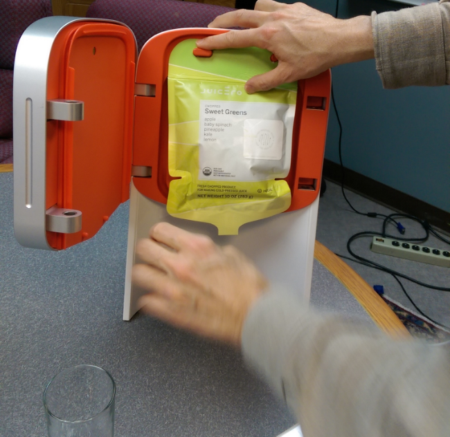 Doug Evans Showing The Juicero In Action