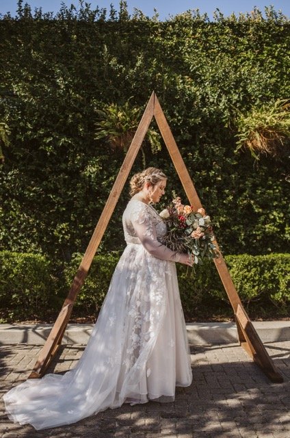 Wedding Planner Park City | Bride triangle arch Medium.jpeg