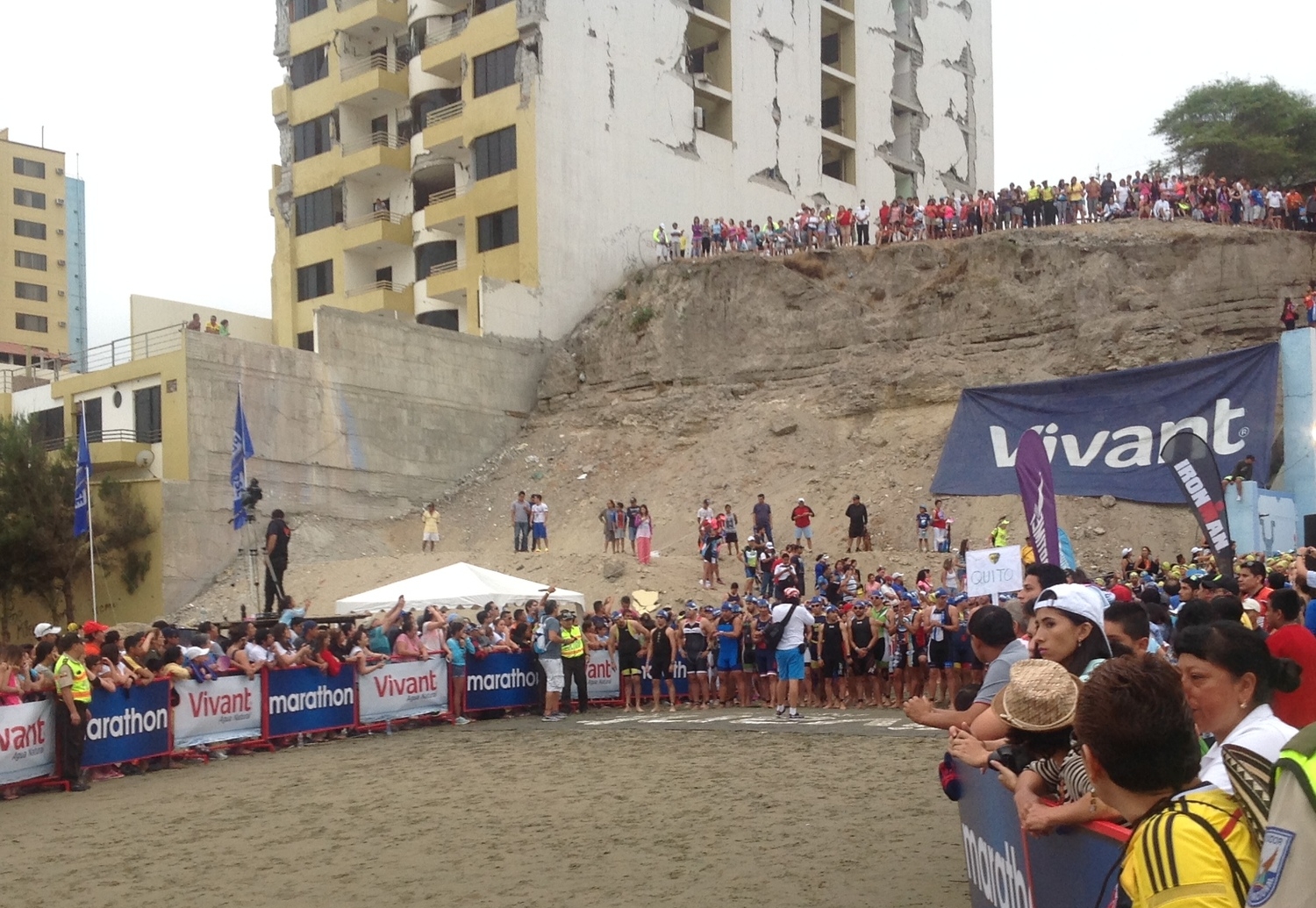Swim start. The cliff/hill in the back ground and you can appreciate a building hit by the earthquake. I'm in the front line waiting.