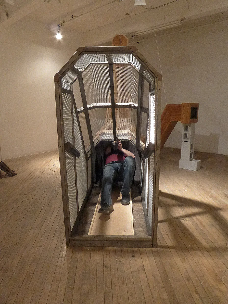 'Tom Ridge' Viewer Orientation Detail Wood framing, Metal mesh, Mahoghany Handrail, Moving Blankets, Cart, Fiberglas Insulation, Metal Floor Grates, Cast Iron Window Weights, Audio Approx: 18’L x 3’W x 12’H 2014