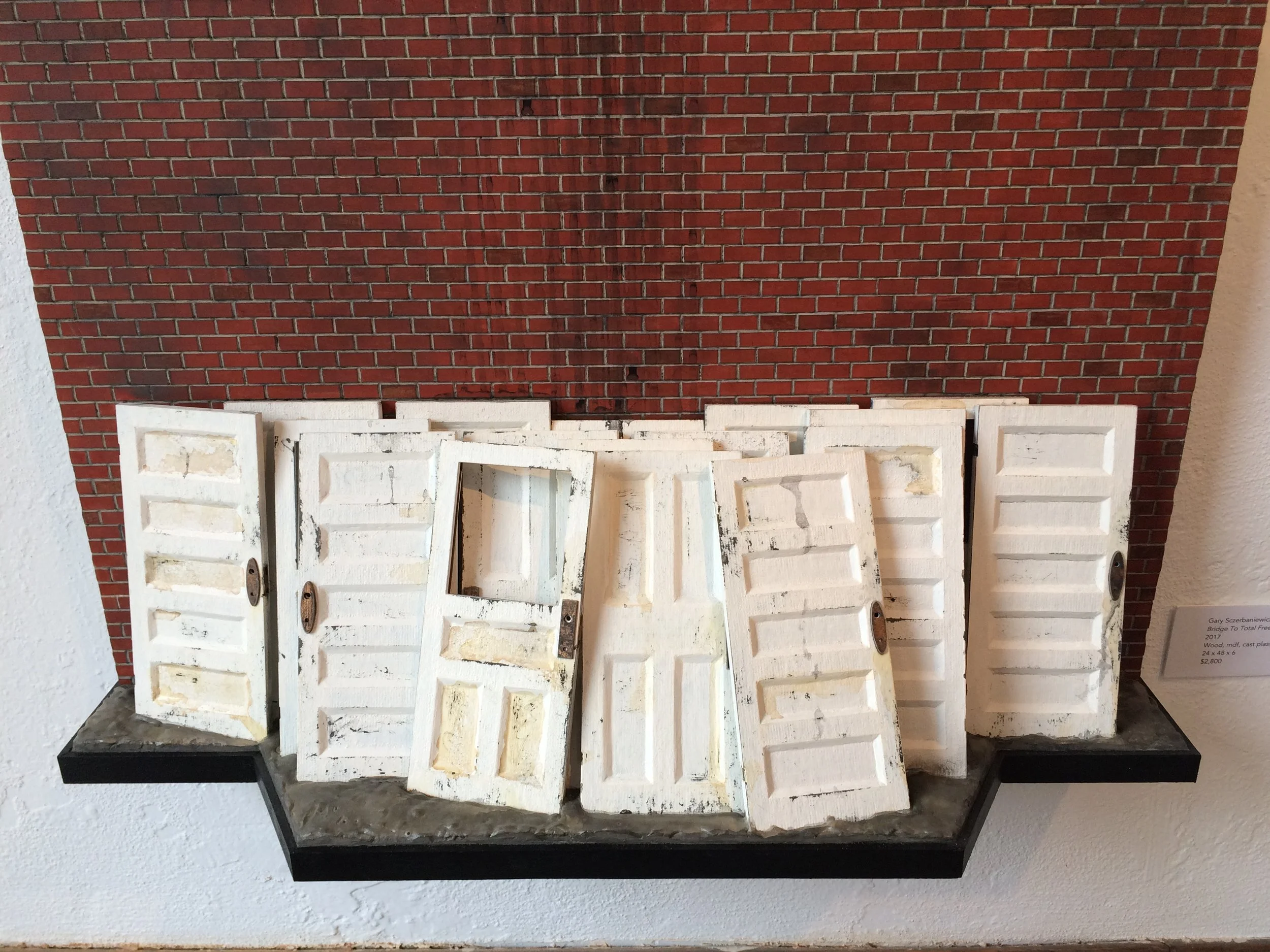    ‘Bridge To Total Freedom'  Door Detail   Wood, laser-cut mdf, cast plastic, chipboard, ink, acrylic, graphite  24” W x 48”H x 8”D  2017  Private Collection 