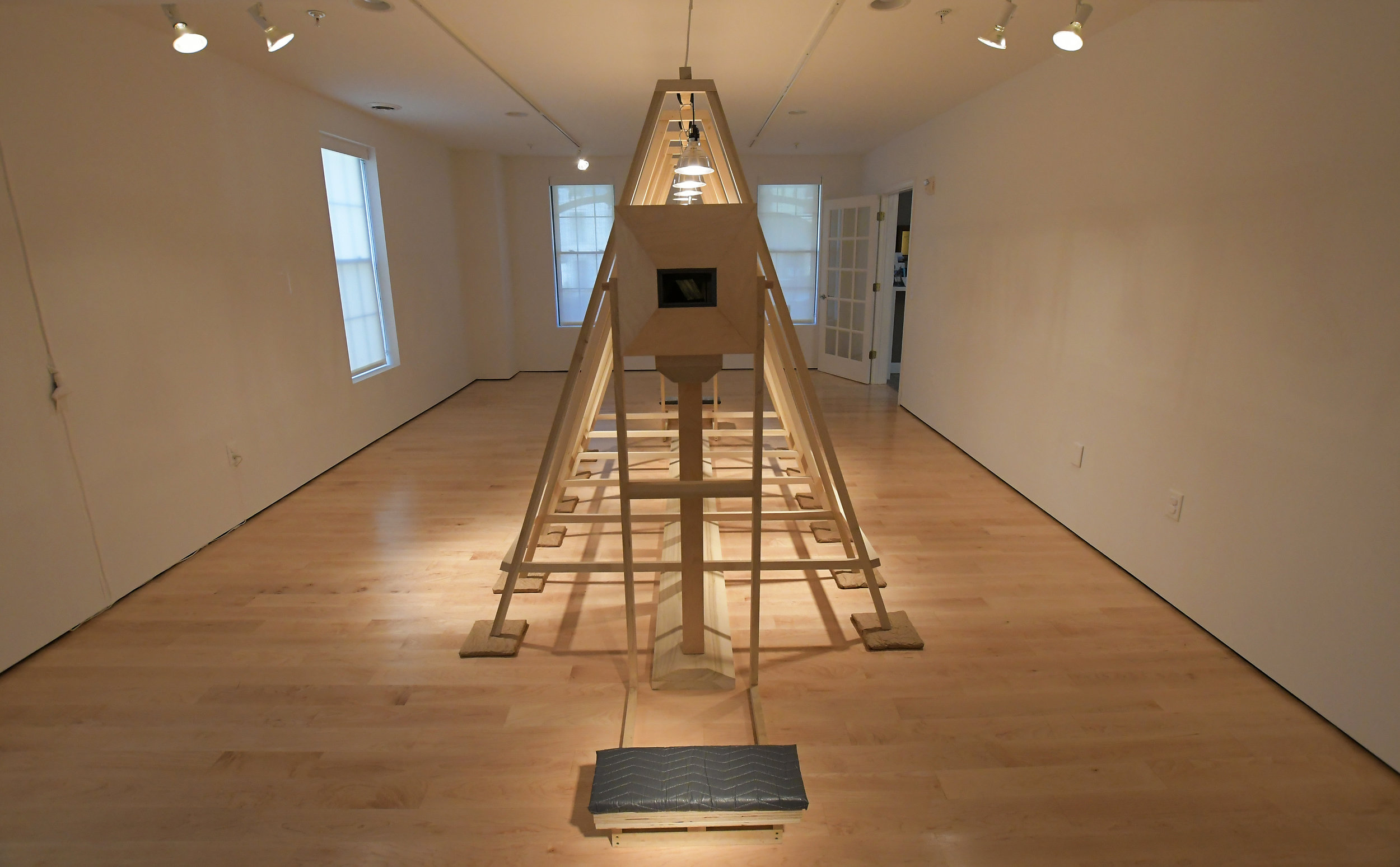 ‘Neil Before Zod: LEM/LAM’ Wood, elevator padding, Clip lights, craft paper, incense 6.5'H x 5.25'W x 12'L 2018 Photo courtesy of Rick McLay