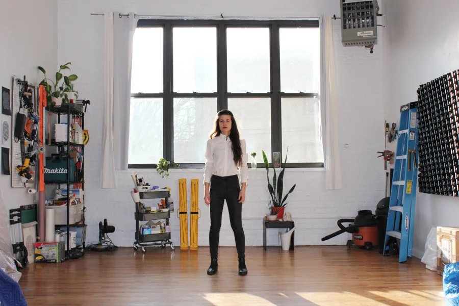 Amanda Martinez (above) in her Bushwick studio. Photo courtesy of the artist.
