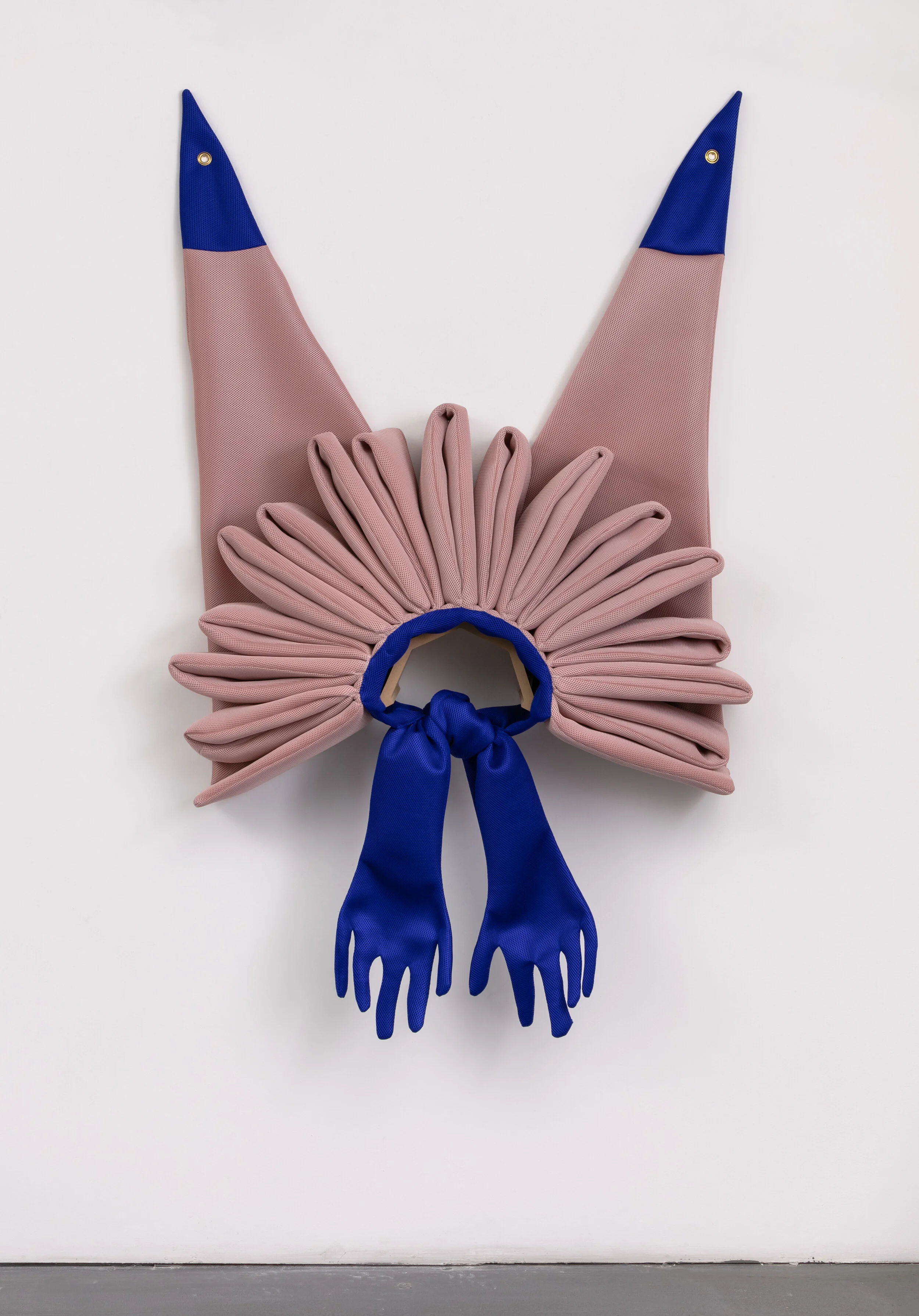 Pink Collar, 2019. Neoprene mesh, thread, foam, batting, grommets, MDF wall mount, 45 x 75 x 14 inches