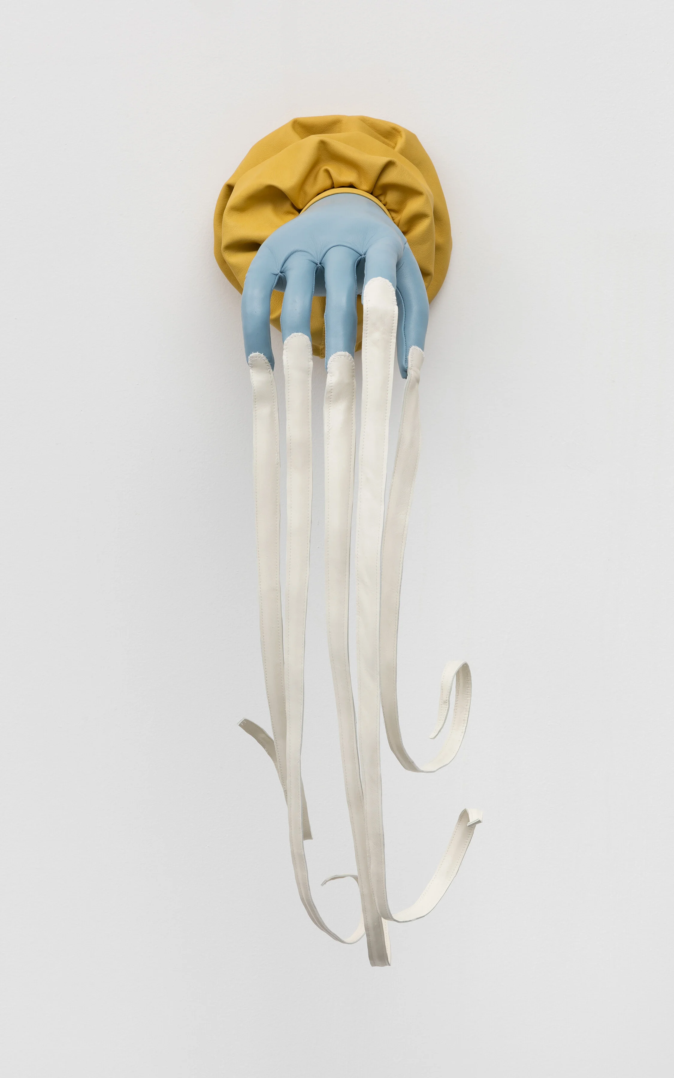The Hand that Feeds, 2019. Leather, thread, polyfil, wire, wood, epoxy, elastic 39 x 8 x 12