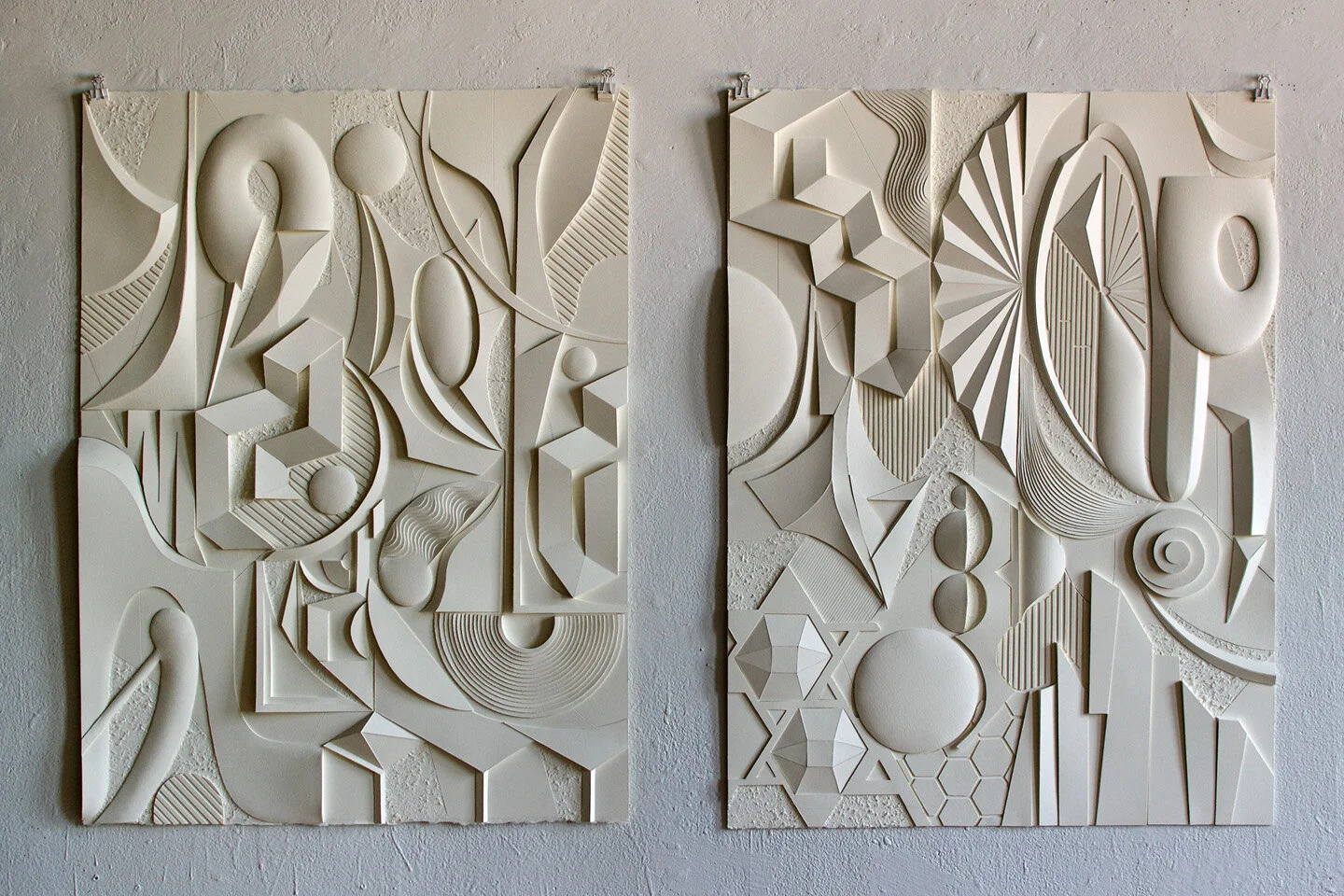 Left to right: Devil’s Purse (2020) and Peacock’s Ring (2020), cutout and abraded watercolor paper, each 31 x 23.5 inches