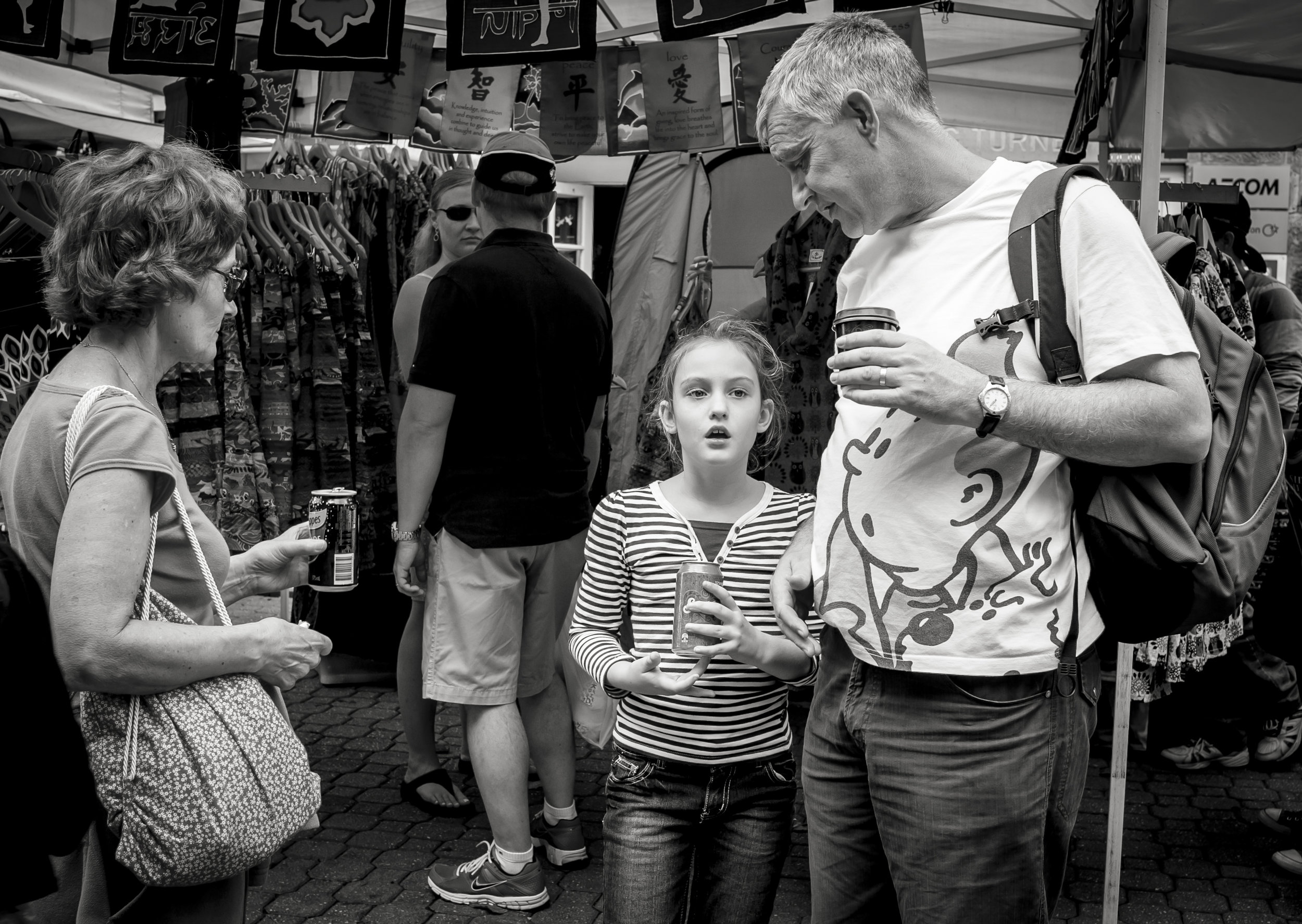 In this case the placement of the people balanced the frame and the girls look added animation, but the t-shirt characters looking directly at the girl, seemingly in surprise was just lucky. Again effort and preparedness brings luck, but lucky just the same.