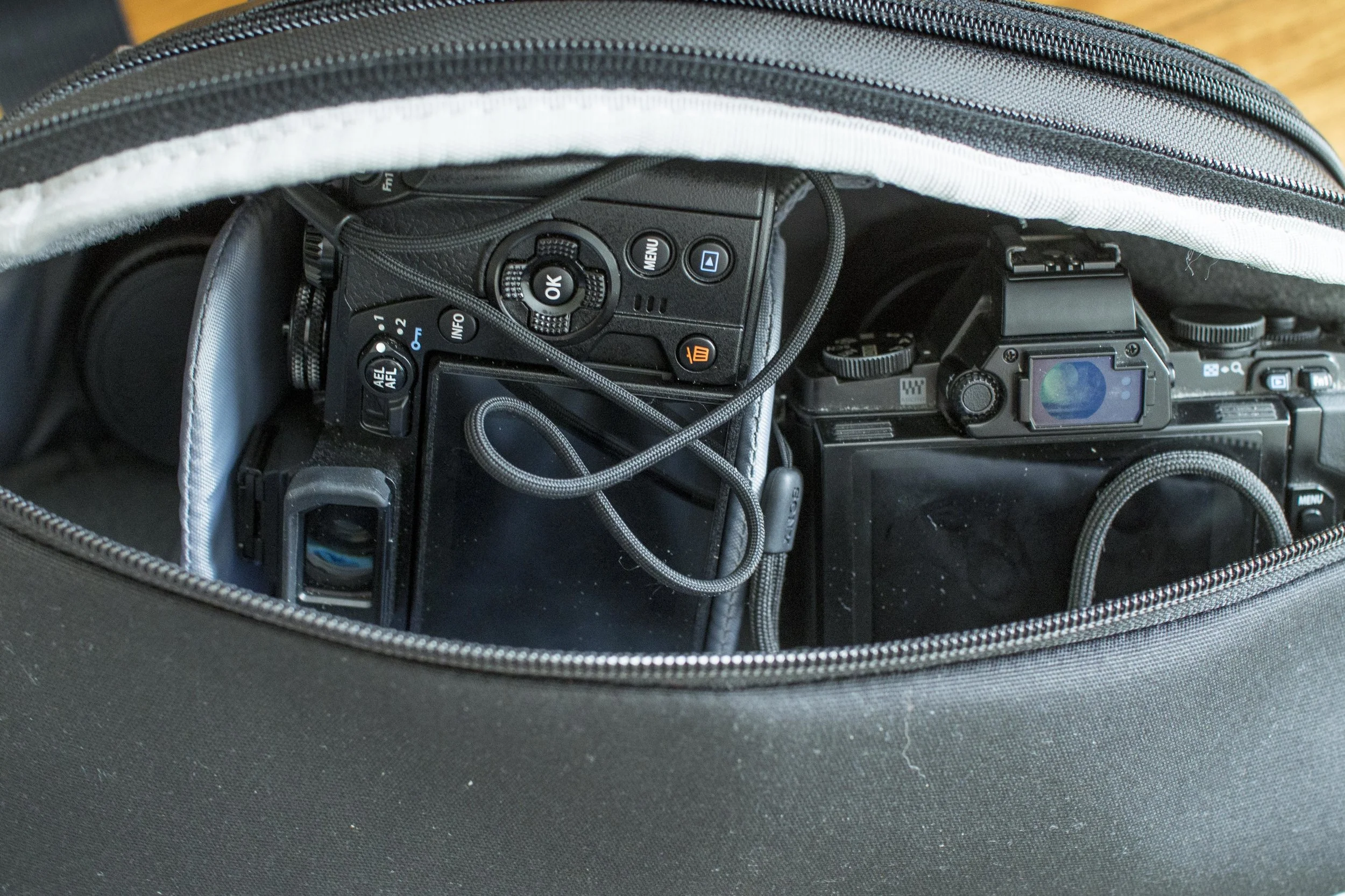 EM1 with 12-400, EM5 with 75mm and little prime on the end.
