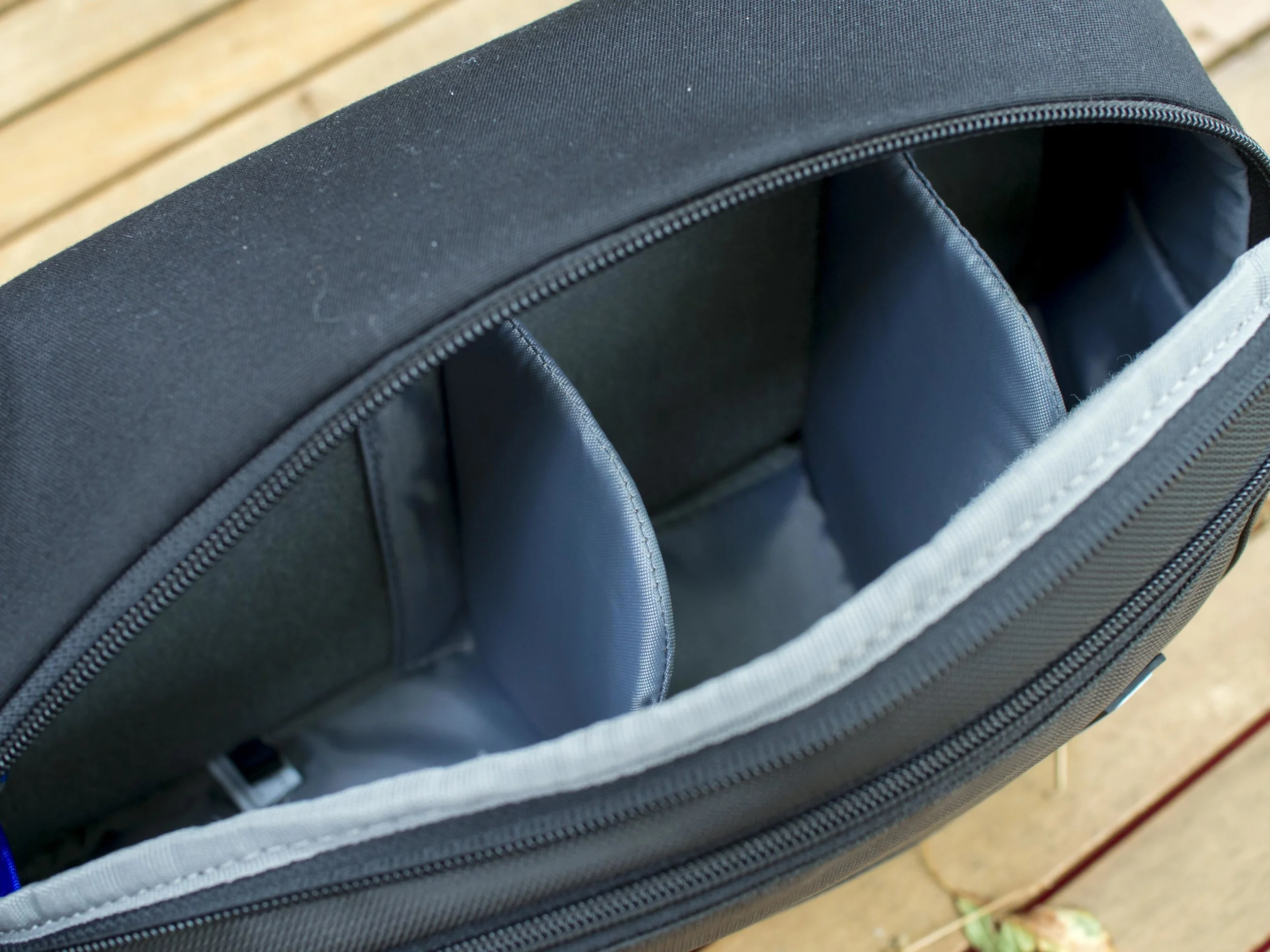 The internals are divided by three tall and one short divider (one removed for this kit and the small one on the floor for added cushioning). They are thinner than Lowepro ones, but stiffer and more padded than Domke. The velcro is very tight and grippy, not the sort that will fuzz up with repeated changes (like a Billingham insert). A small Billingham 2 lens box divider will fit in one section also for an all primes day.