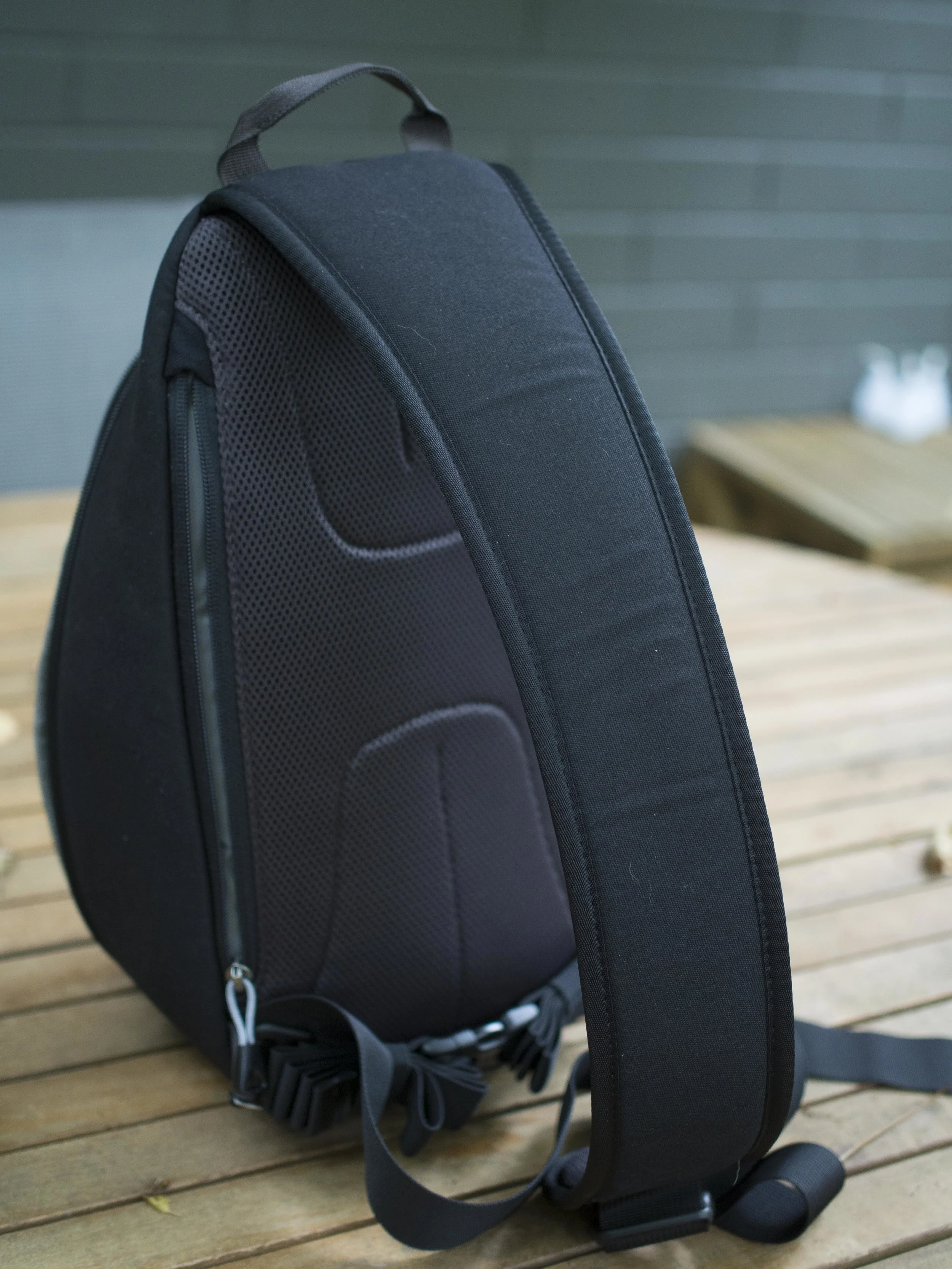 The broad and very comfortable strap runs up-down when worn at the back and makes the bag feel effectively weightless. I am not sure a fully loaded 20L would feel the same, but it would definitely feel lighter than a shoulder bag. The strap is easily adjustable which is good as the bag feels better when tighter-higher up the back, but a lower sit gives more “swing around” room when fiddling with gear. The only thing I would add is a small strap anchor for an optional phone or utility pouch to be placed on the front.