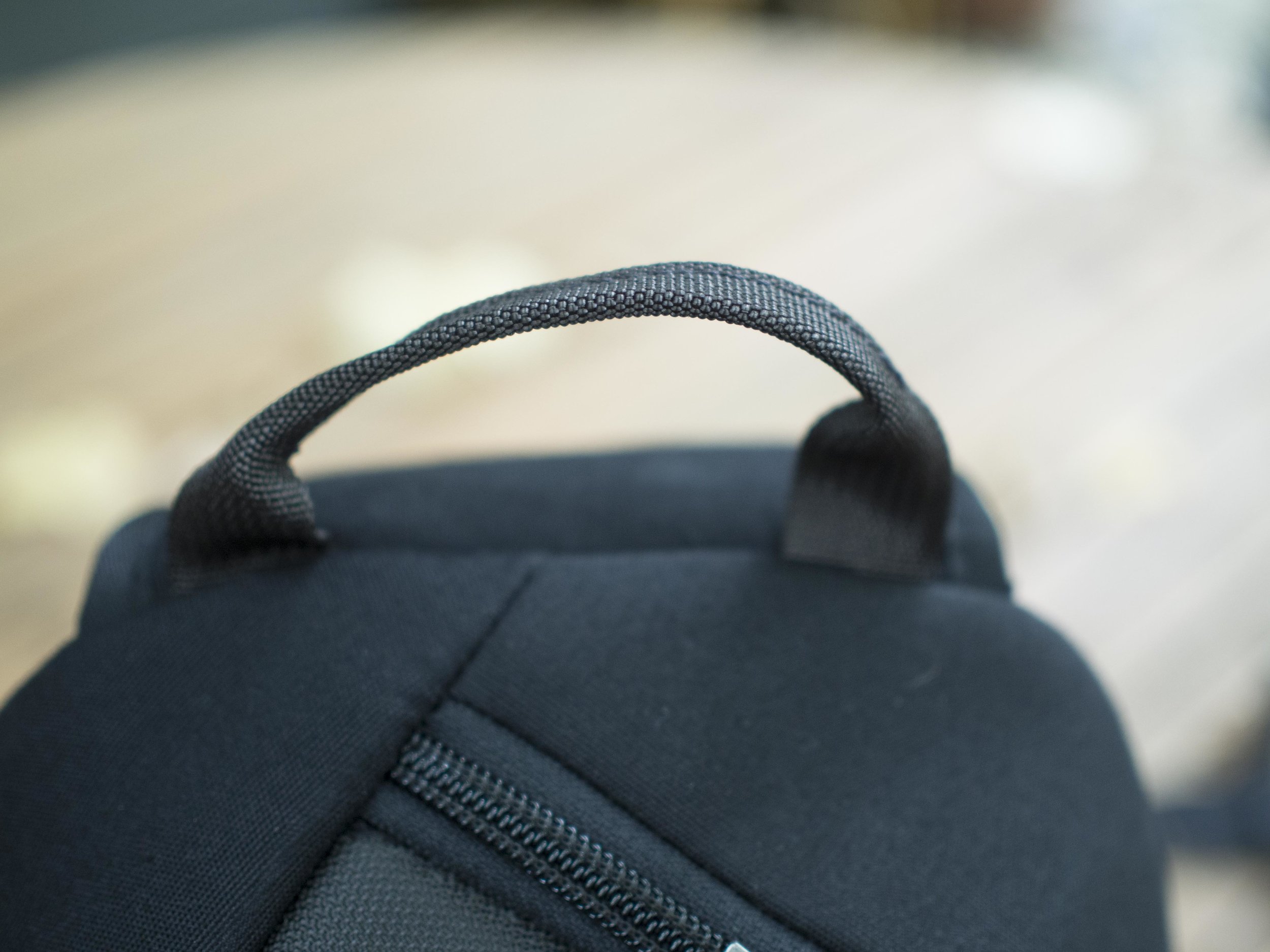 A handy top strap. The bag stands up well when full, if loaded sensibly.