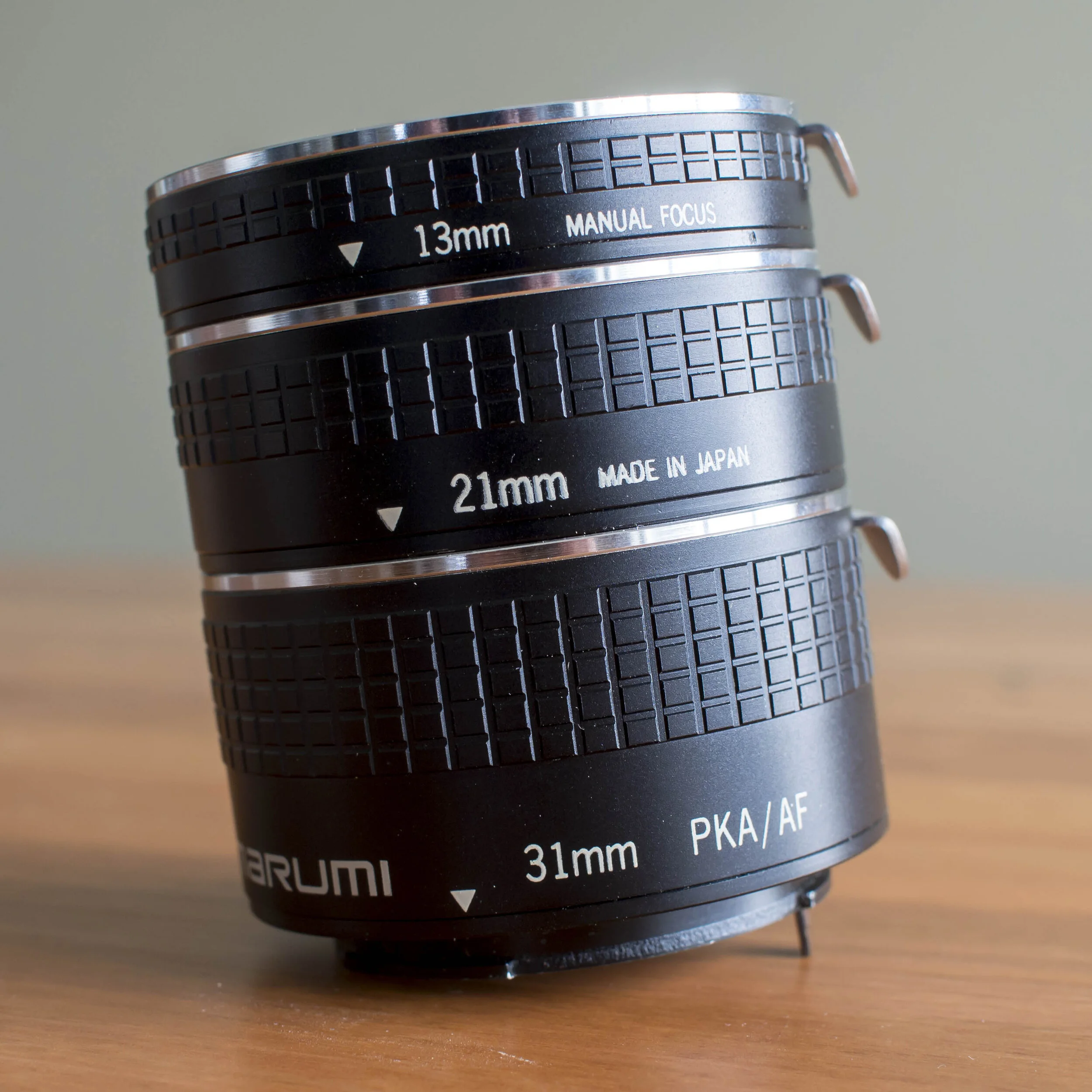 The usual set of three extension tubes. The shortest one will have little effect on longer lenses except to rob them of infinity focus, but the longer one on a shorter 50mm lens would likely produce 1:2 or closer magnification at the cost of about 1 and a 1/2 full shutter speeds of light.