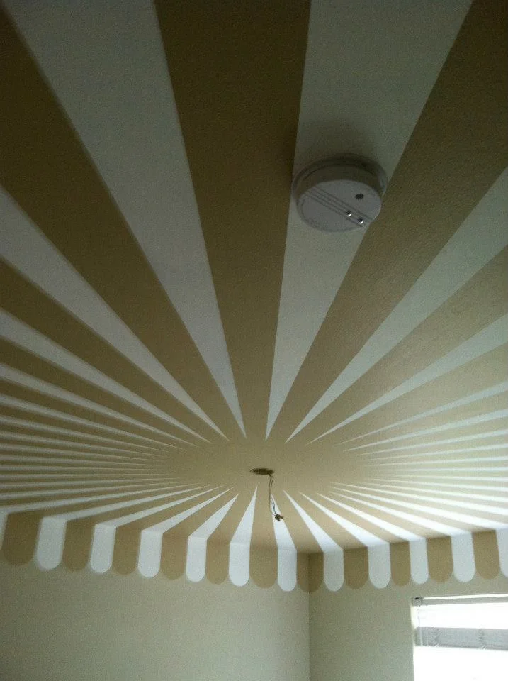 I was asked to make sure that the smoke alarm was disguised as much as possible, so I centered it in the white stripe.