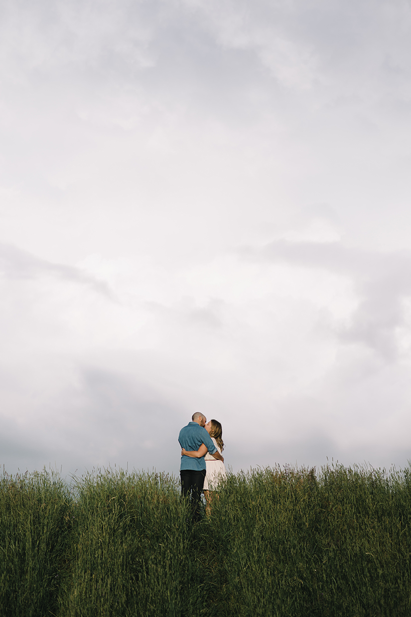 couple in a field, Lois Hole Park, Engagement Photographer St. Albert