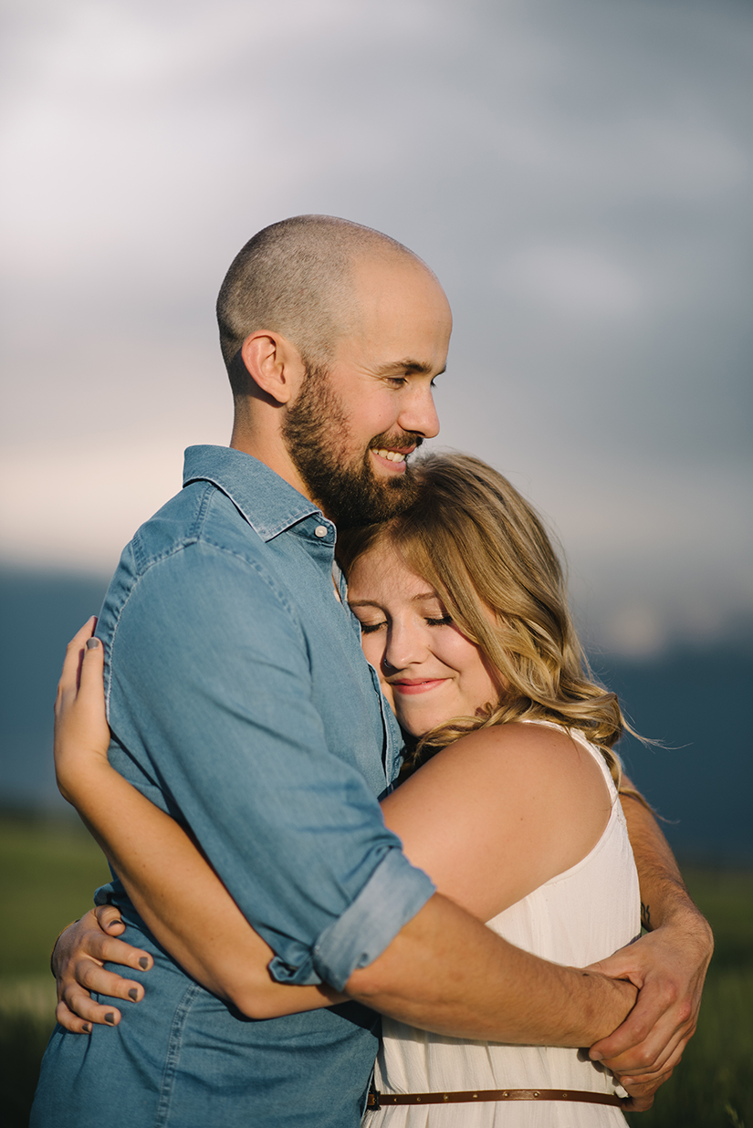 Hugging, bohemian couple, Engagement Photographer in St. Albert AB