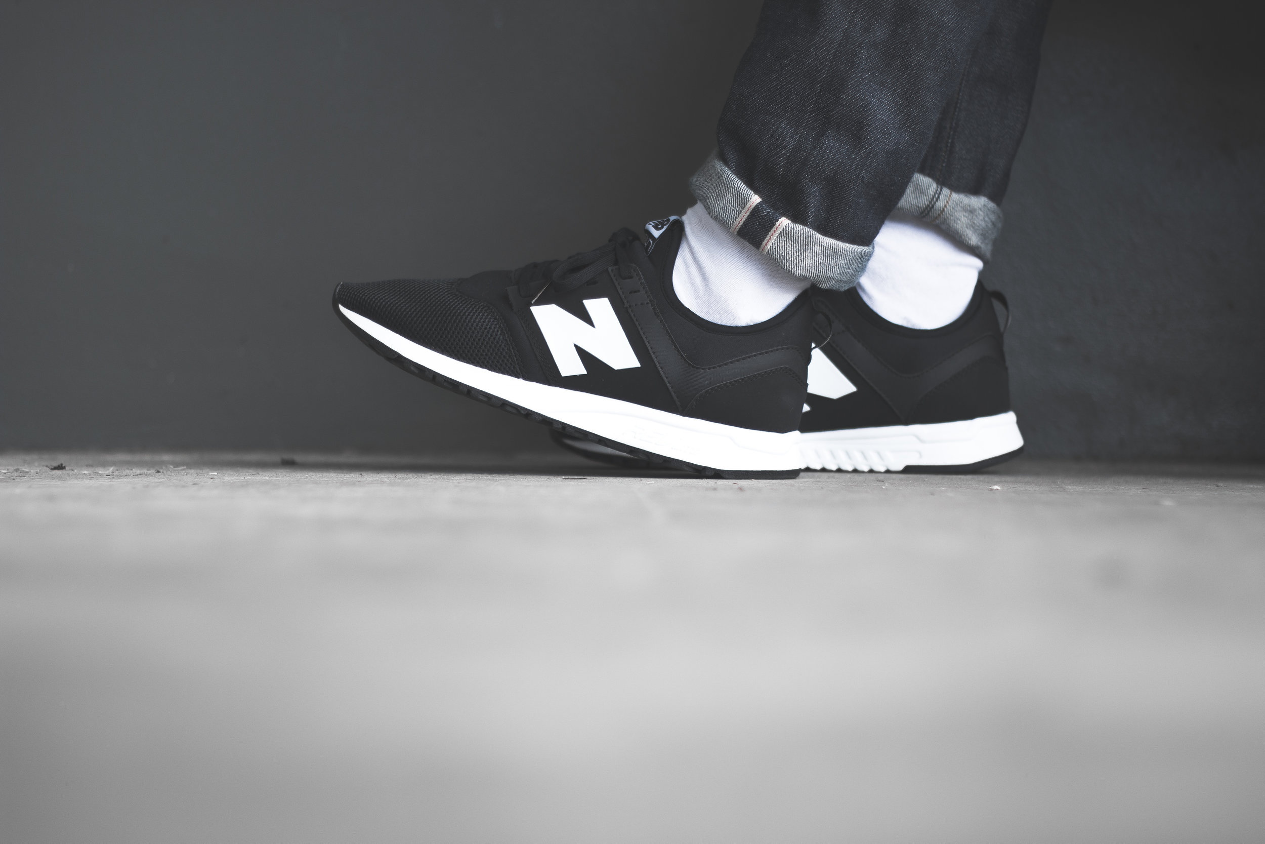 new balance 247 black on feet