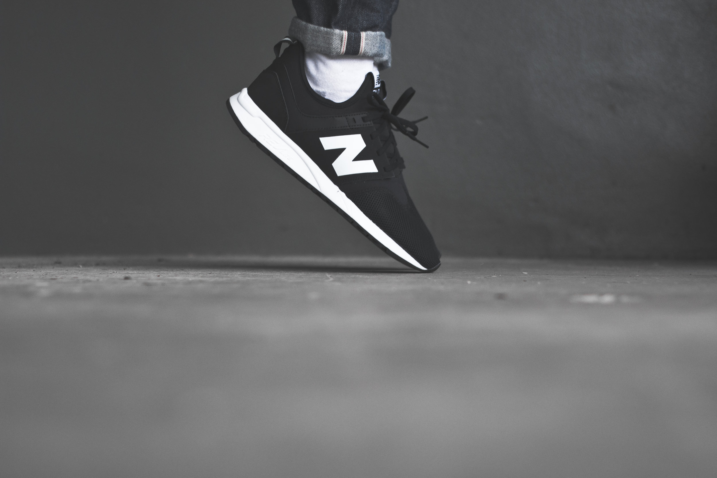 new balance 247 black on feet