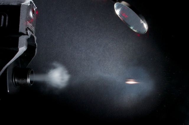 Here’s a photo I took of a BB fired from an air pistol. I’ve not cropped this, so you can see the laser and mirror. The sensor board is underneath, out of shot. I used a normal speedlight on lowest power, but there’s still motion blur as it’s travelling at around 400 feet per second (125 m/s).