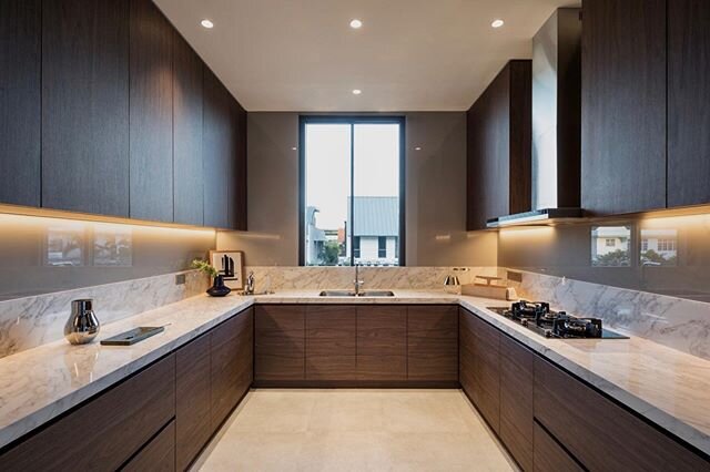 Wet kitchen design for Lorong K project, featuring walnut wood grain laminate and large format tile for the counter top.