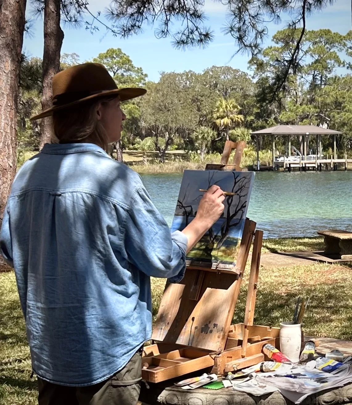 Annastasha Larsen painting on site in Florida.jpg