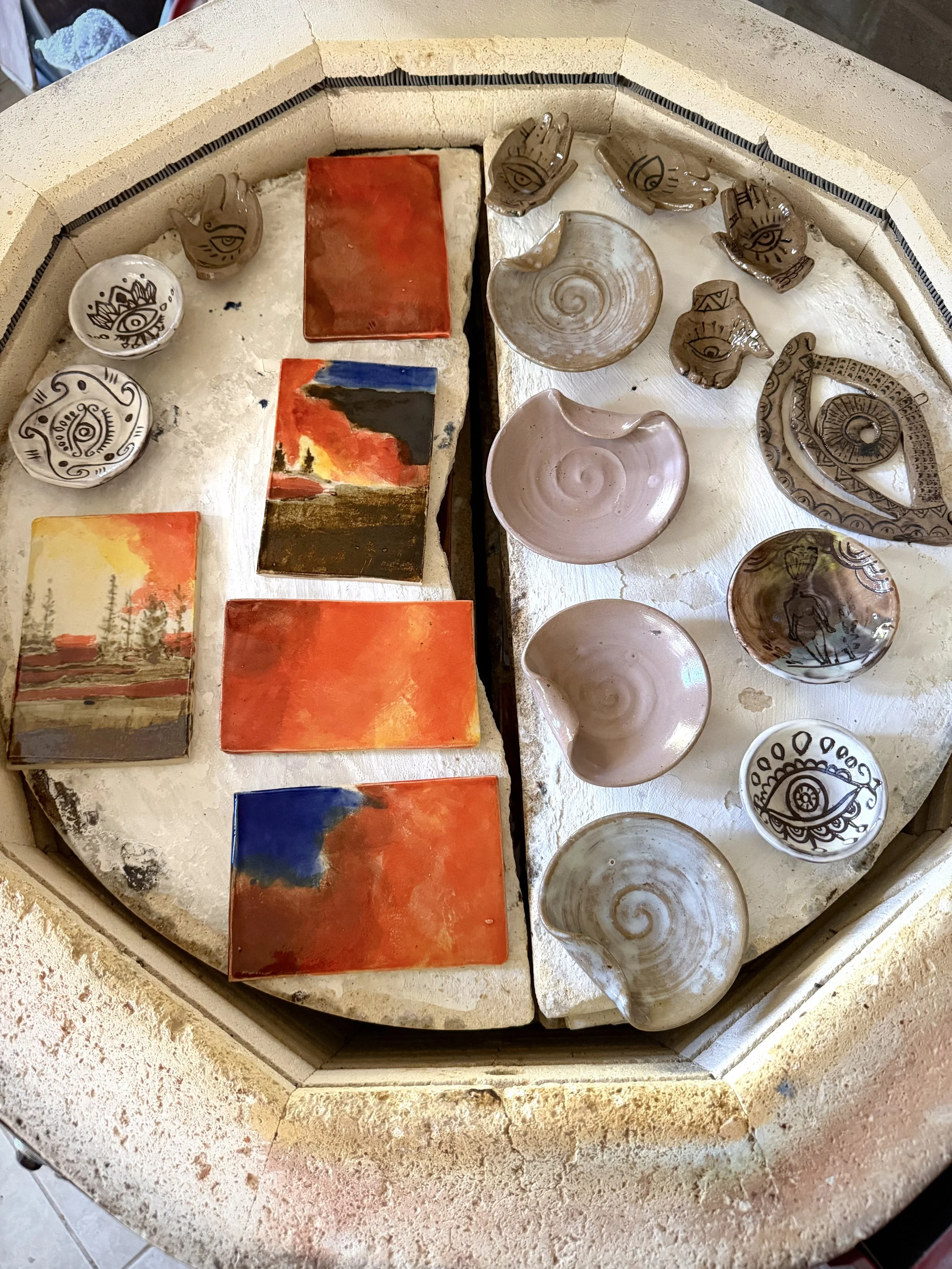 Wildfire tile paintings in kiln.jpg