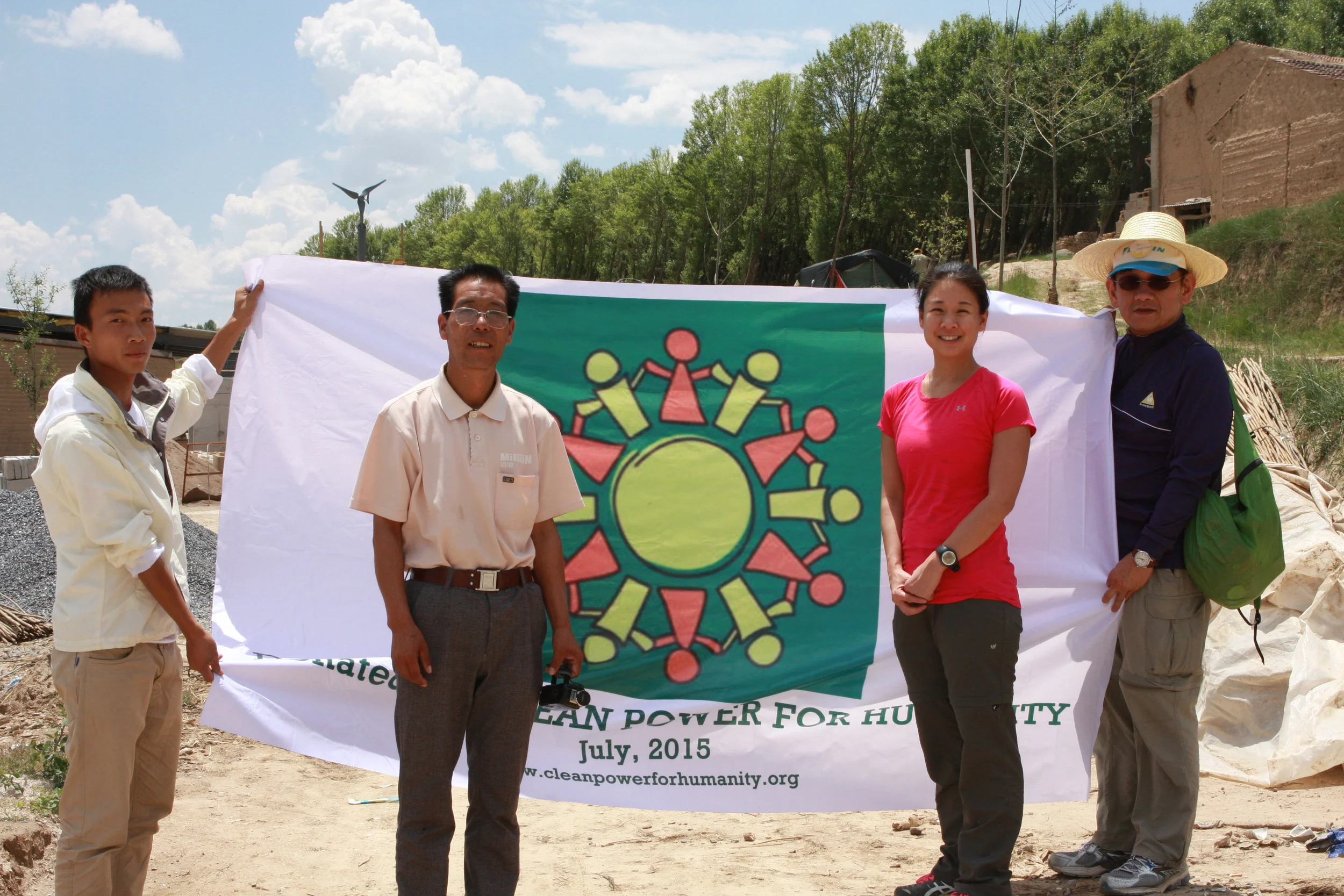 Left to Right: Qiangqiang li (chief engineer), village president, jacqueline Yang (CEO, Clean power for humanity), and David Yang (REpresentative, clean power for humanity)