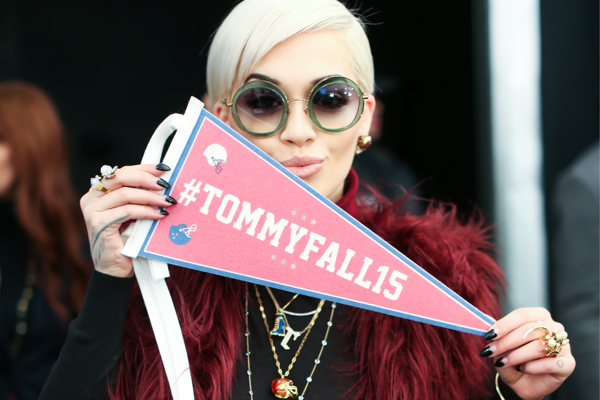   Rita Ora  waving her pennant for team Tommy! 