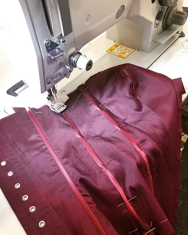Making progress on my corset, sewing ribbon channels on the top fabric for the steels!