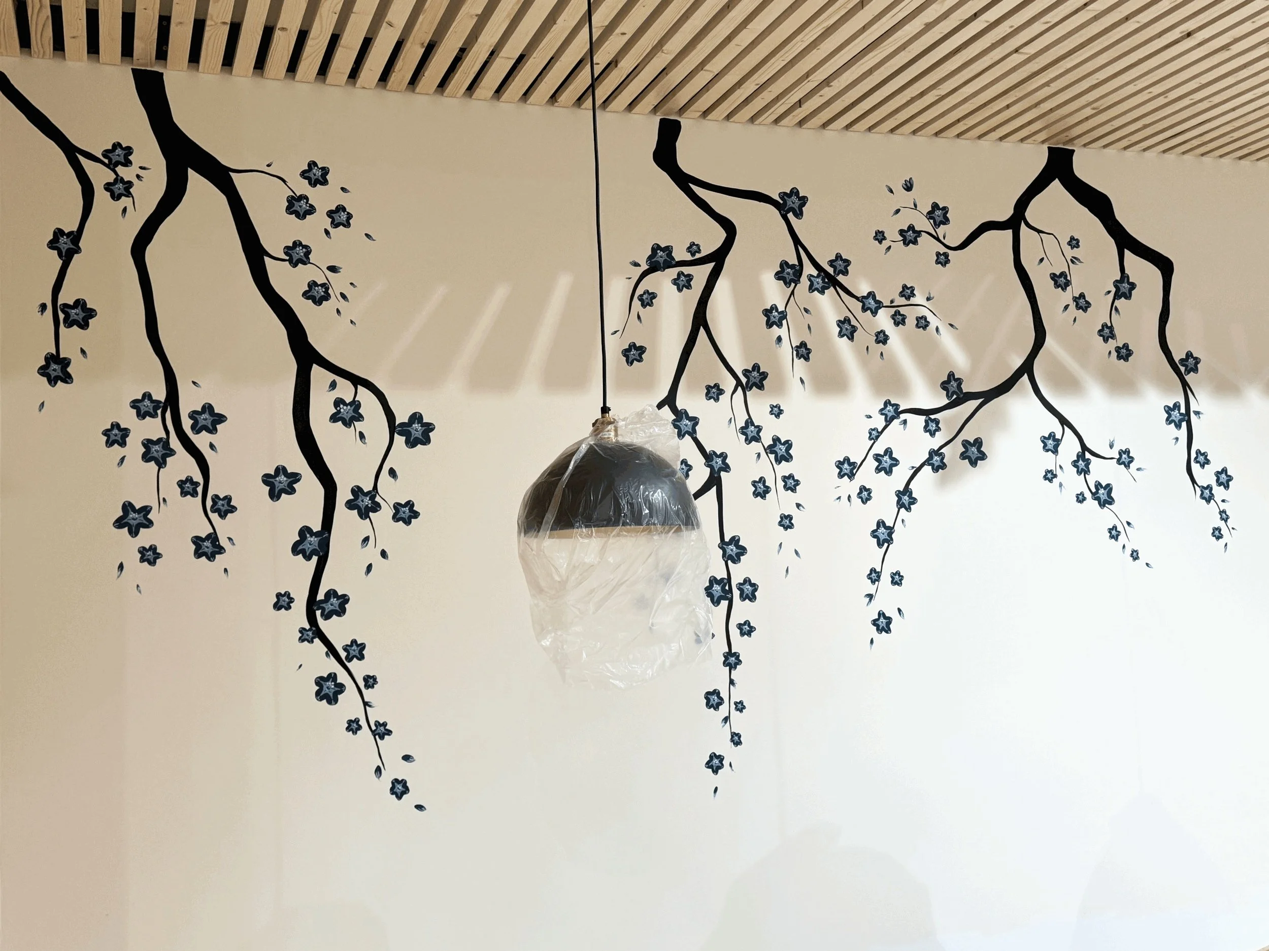 I designed and painted a mural accent wall for the dining room.