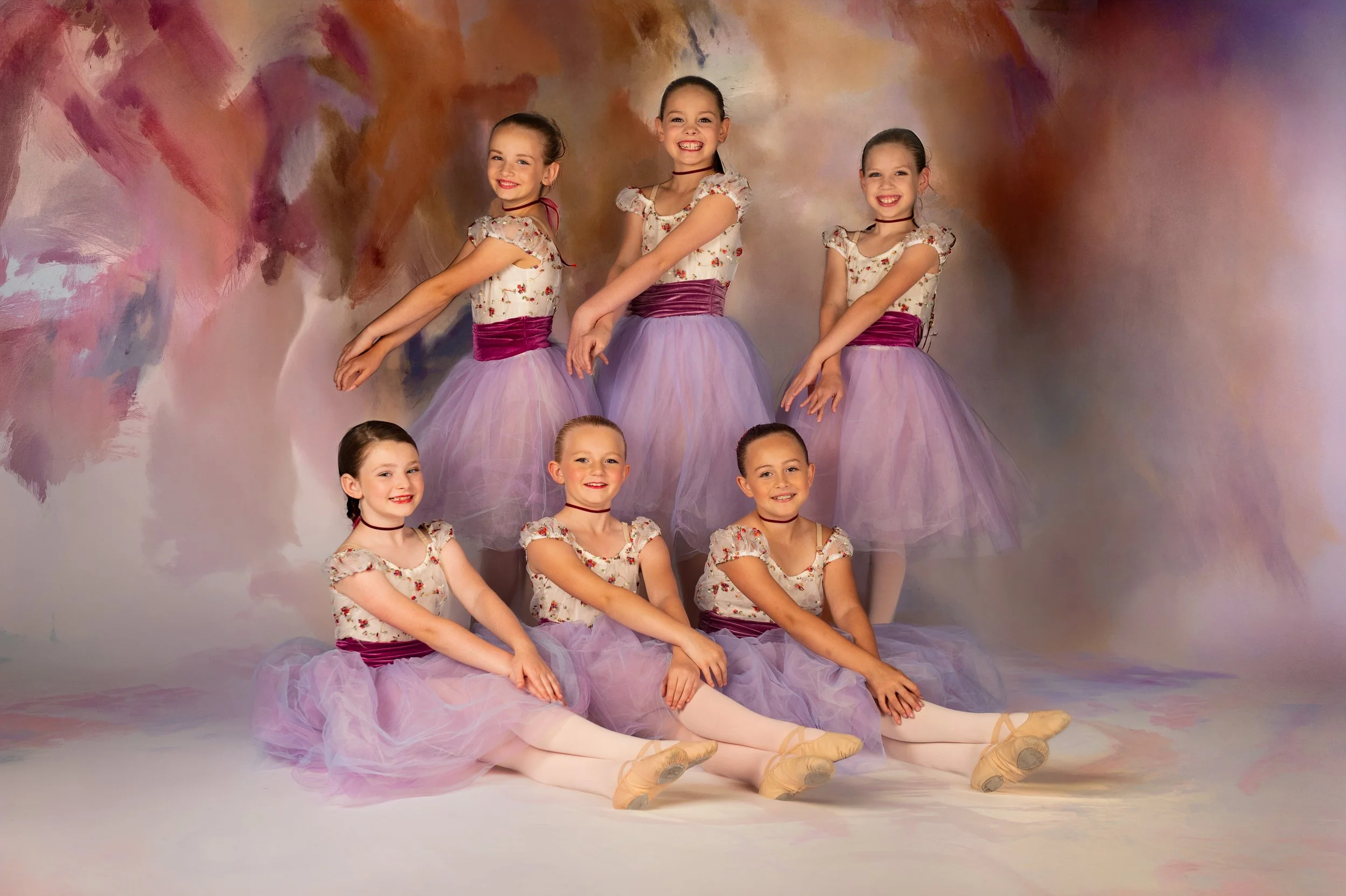 Young dance group portrait with coordinated costumes