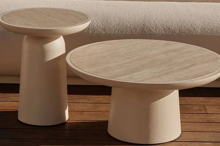 Sculptural simplicity echoes midcentury design in our outdoor collection, where sleek and sophisticated lines provide an understated foundation for the contrasting textures of aluminum and travertine. The mixed&ndash;material Round Coffee Table 30&qu