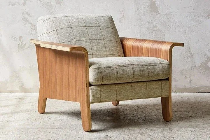 This contemporary accent chair reimagines the classic club chair with playful bent-ply arms and a striking silhouette that makes a statement from every angle. Available in luxurious fabric or innovative Vegan AppleSkin&trade; Leather upholstery, each