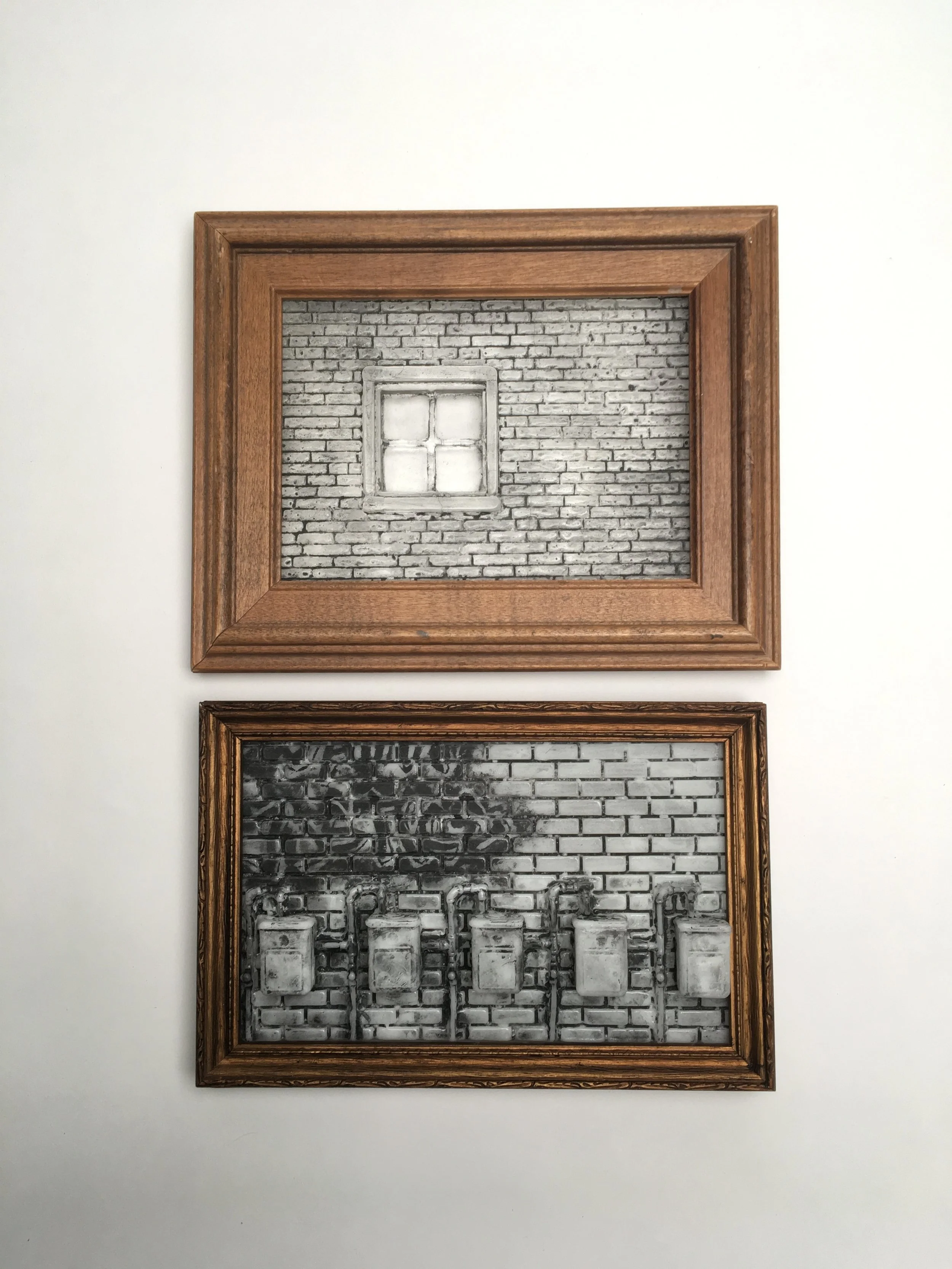 “West Coast Bricks” kiln cast cast glass, enamel, found wood frame, 8.5” x 7” x 0.5”  “Sunny 1BR on Lake Merritt” kiln cast cast glass, enamel, found wood frame, 8.5” x 7” x 0.5