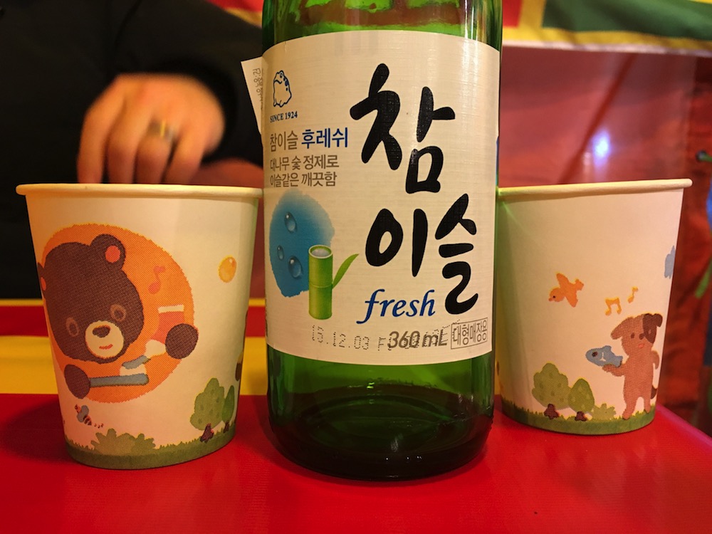 EY can't I just enjoy my soju in a tent without some bear trying to tell me how to brush my teeth!?! And what does that musical dog think he is doing with that fish?!