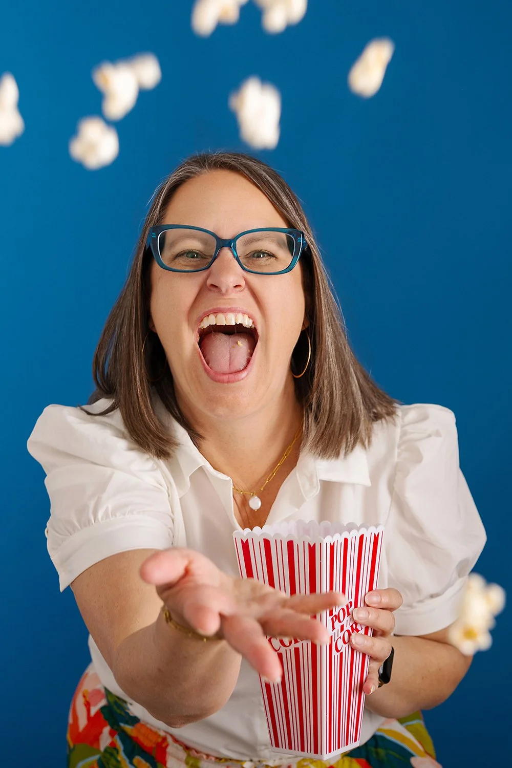 This personal branding portrait was created in Dana Pugh Photography’s Okotoks studio for a realtor named Sundi Clark. The image was designed to feel approachable and confident, with neutral styling and natural light while being fun and quirky to mat