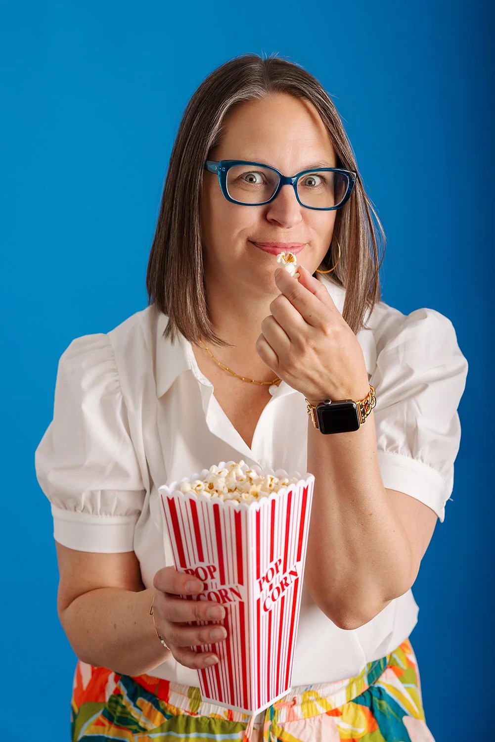 This personal branding portrait was created in Dana Pugh Photography’s Okotoks studio for a realtor named Sundi Clark. The image was designed to feel approachable and confident, with neutral styling and natural light while being fun and quirky to mat