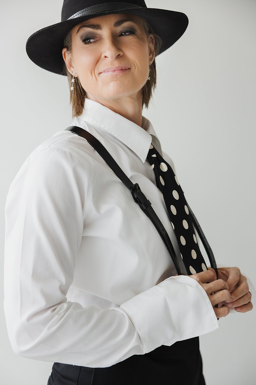 This personal branding portrait was created in Dana Pugh Photography’s Okotoks studio for Julie Boak from Awedity. The image was designed to pay tribute to Dianne Keaton to embrace this client's black and white and colour branding. Branding sessions 