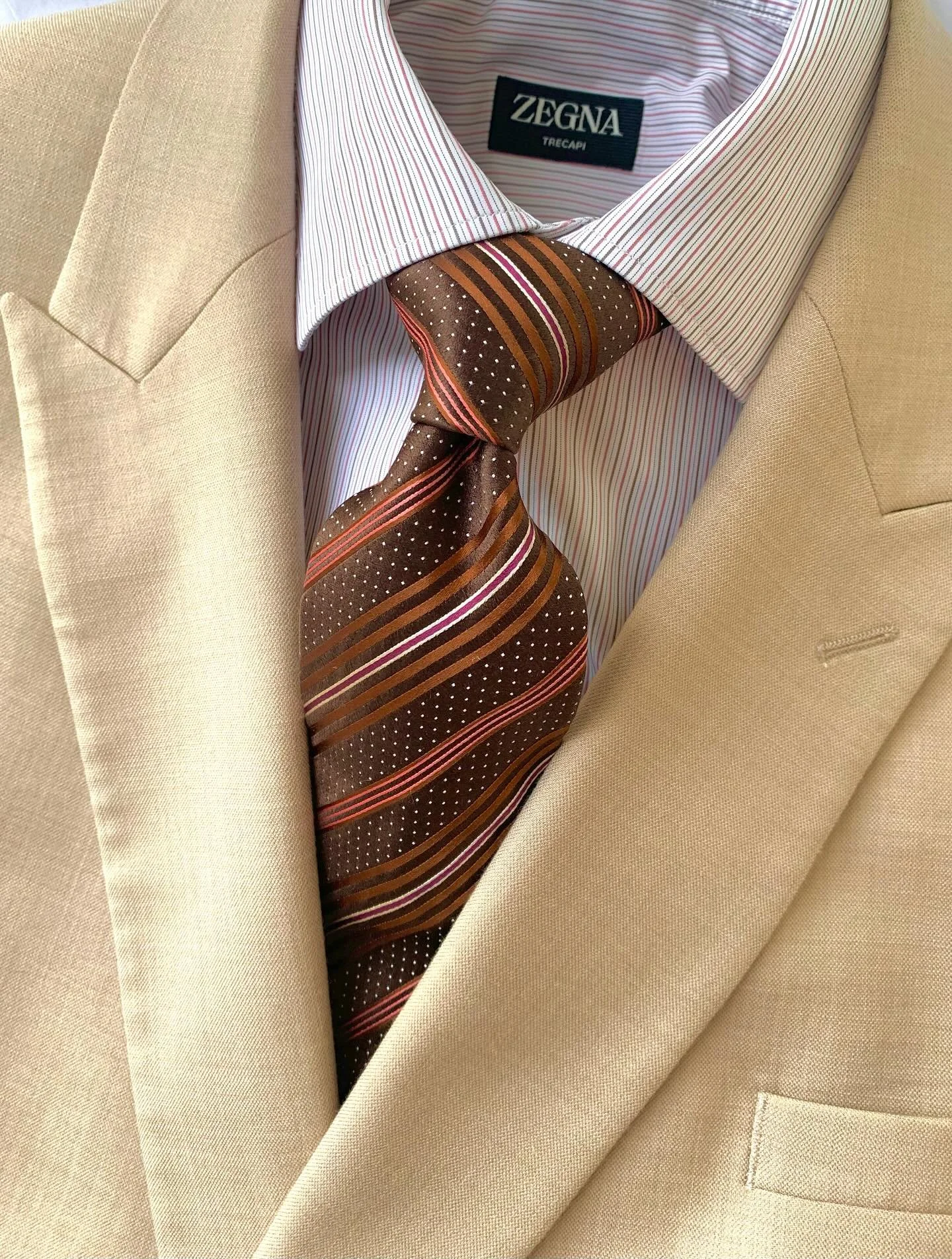 Topman beige double-breasted sport coat, size 46R: dress shirt from Zegna, size 15.5: necktie from Zegna.
@topman, @zegna