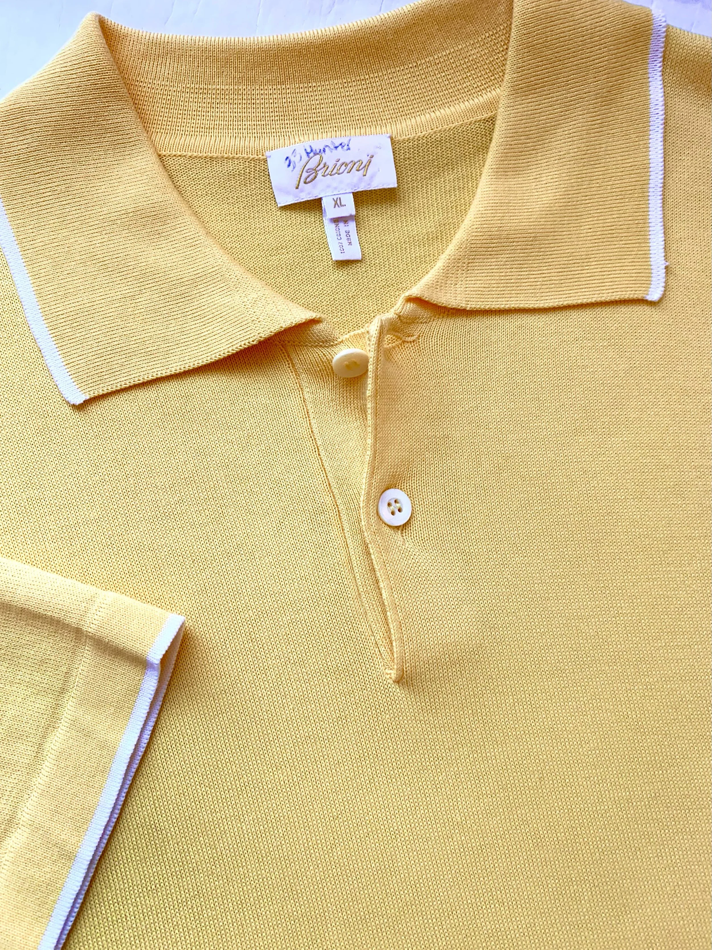 Brioni yellow polo style short sleeve shirt, size XL.
@brioni_official