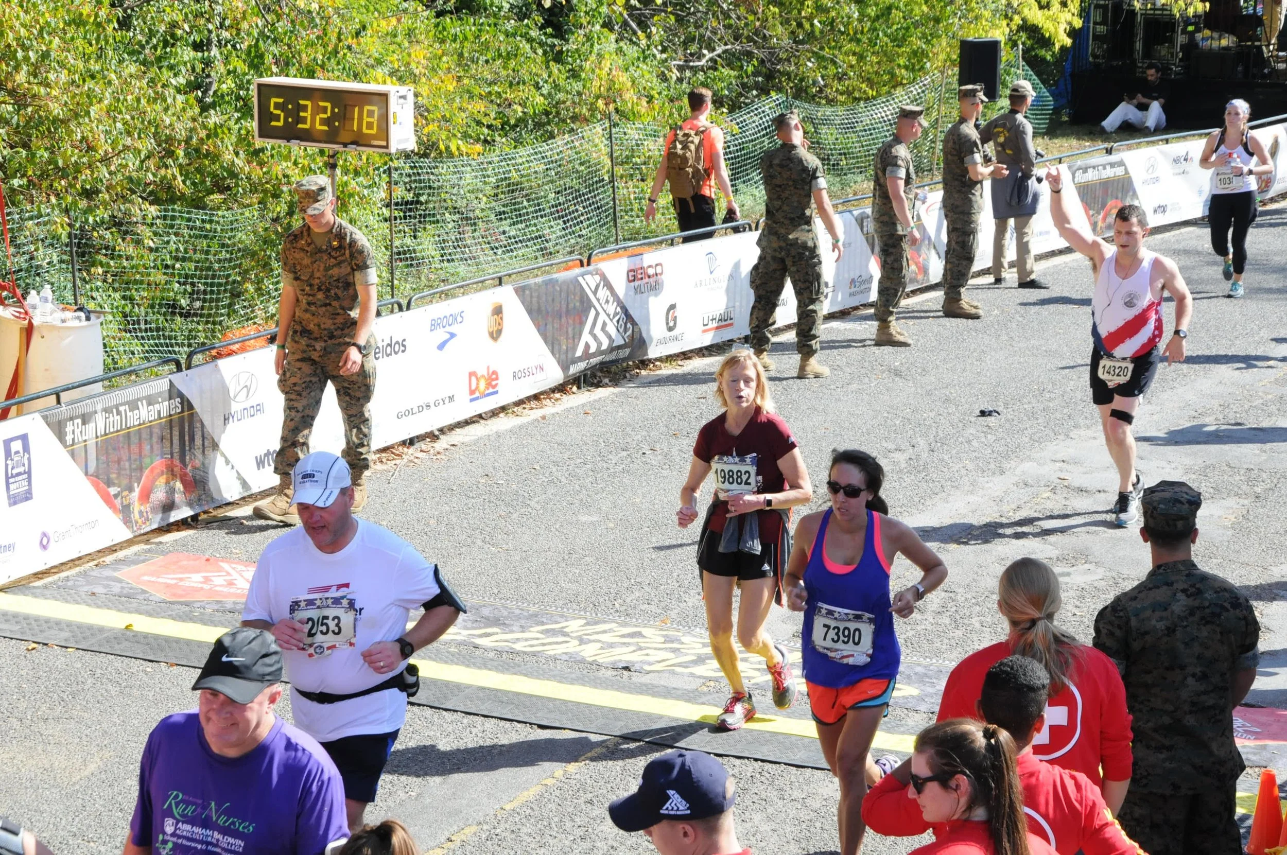 everyone is exhausted at The end of a marathon, as seen above at the Marine corps marathon 2017. MOre physical activity = Better sleep