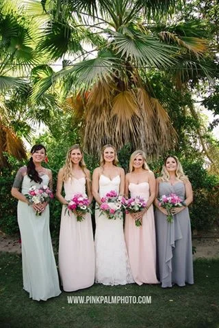 Bride and the pastel bridesmaids