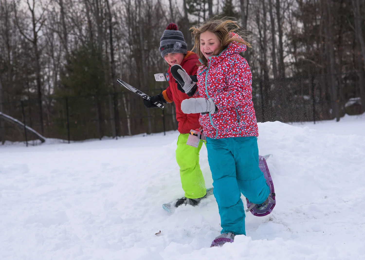 Madeline Wolfgram, 10, and Benjamin Wolfgram, 7, of Scarborough compete in the Snow Shoe Obstacle Course.