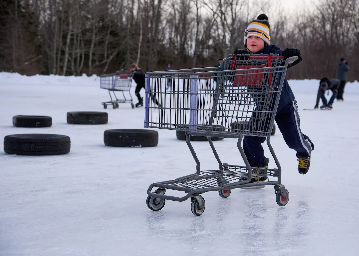 Wyatt Grondin, 9, of Scarborough pushes a shopping cart through the Obstacle Course.