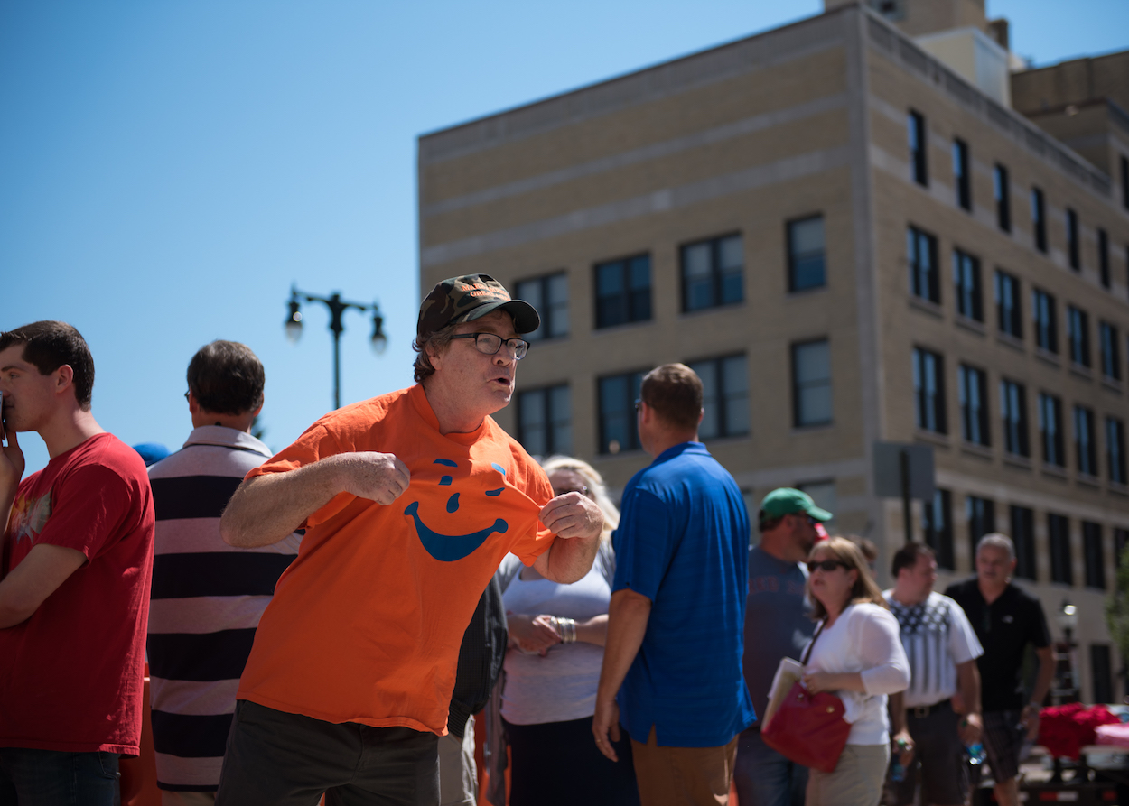 An unidentified Donald Trump supporter barked and meowed back at a protester’s sign asking “Are puppies or kittens next?” The sign referred to Trump having a crying toddler removed form an earlier rally.