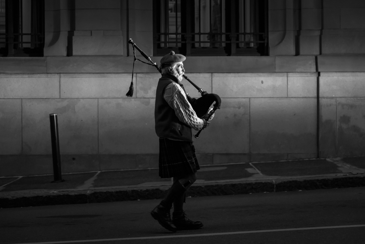 A bagpiper leads a candlelight procession up Preble Street in Portland to honor the passing of Maine's homeless at the annual Portland Homeless Persons' Vigil on December 21, 2015.