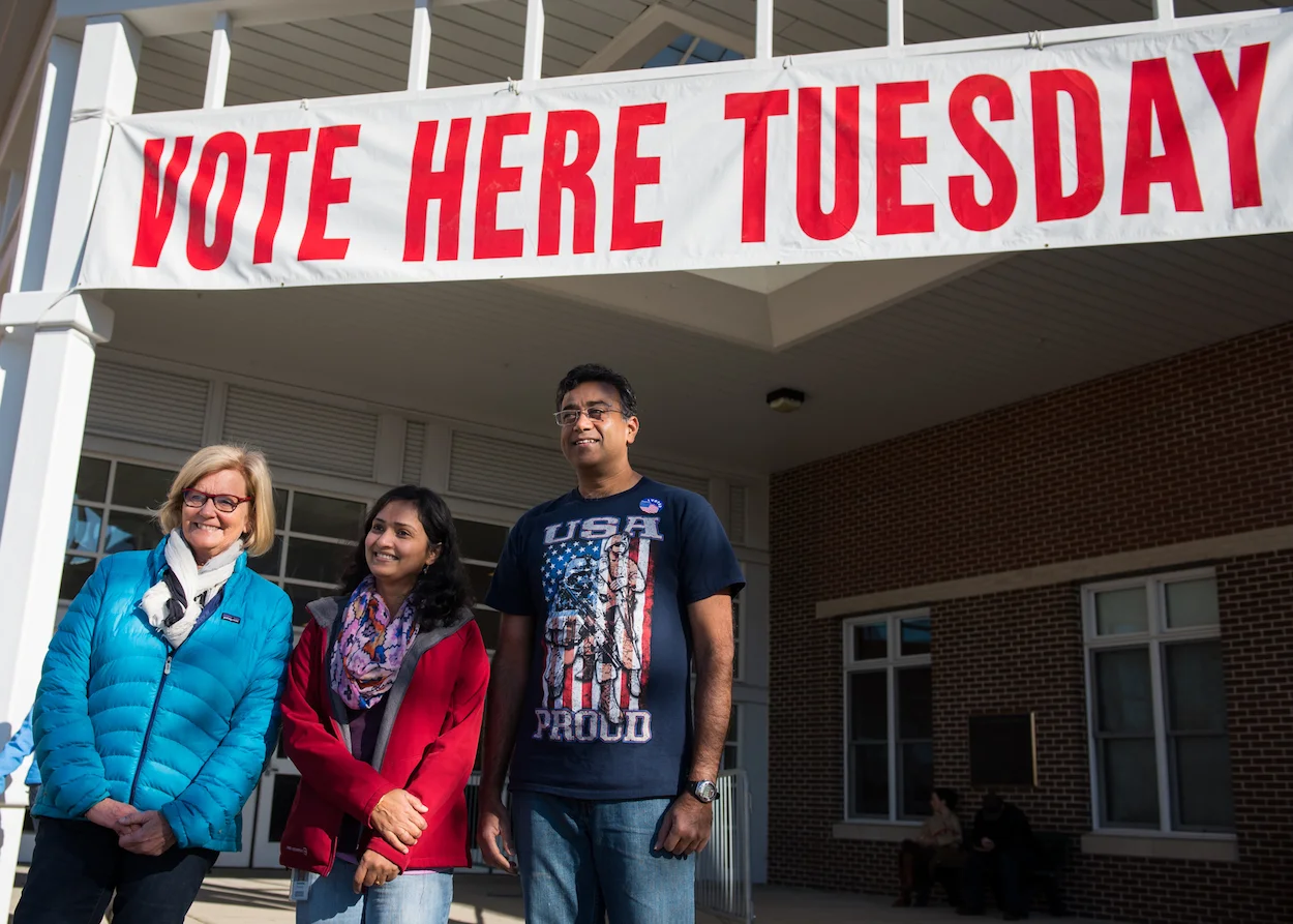 Congresswoman Chellie Pingree poses with Anamika Pradeep and her husband Pradeep Sathyanarayana outside Scarborough High School. After 17 years of residency, the couple became U.S. citizens in 2015 and voted for the first time this Election Day.