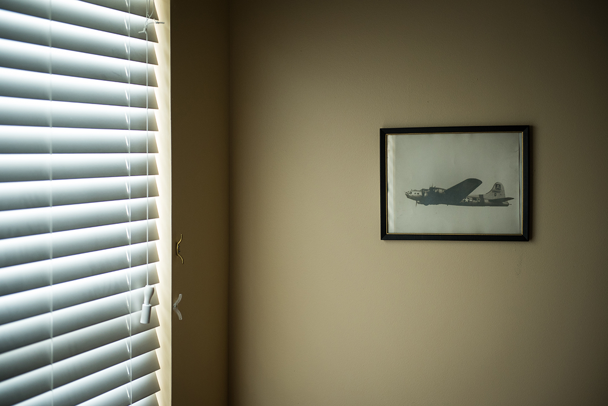 A photograph hangs in Glover's bedroom of a B-17 piloted by Glover leaving England on the way back home after the war.
