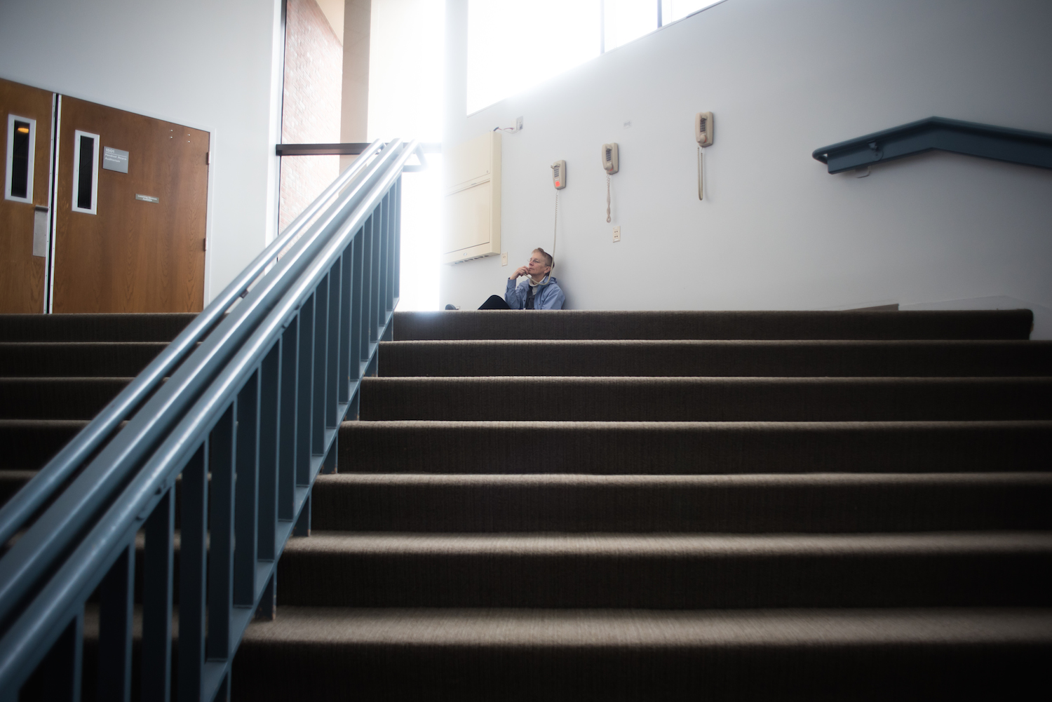 A visitor to Maine Medical Center's Bramhall Campus in Portland listens solemnly to the telephone Wednesday, May 4, 2016.